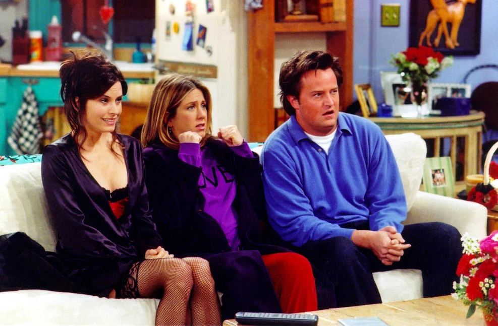 Getty Images. Actors Courteney Cox Arquette (L), Jennifer Aniston (C) and Matthew Perry are shown in a scene from the NBC series "Friends".