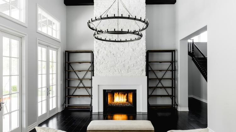 The two-story Mediterranean in Calabasas features contemporary interiors with textured tile accents, modern fixtures and gothic wallpaper. (Riley Jamison)