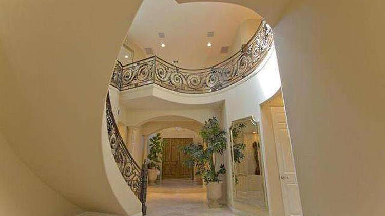 The Mediterranean-style home in Sherman Oaks sits behind gates and has a swimming pool and spa. (Shawn Cordon)