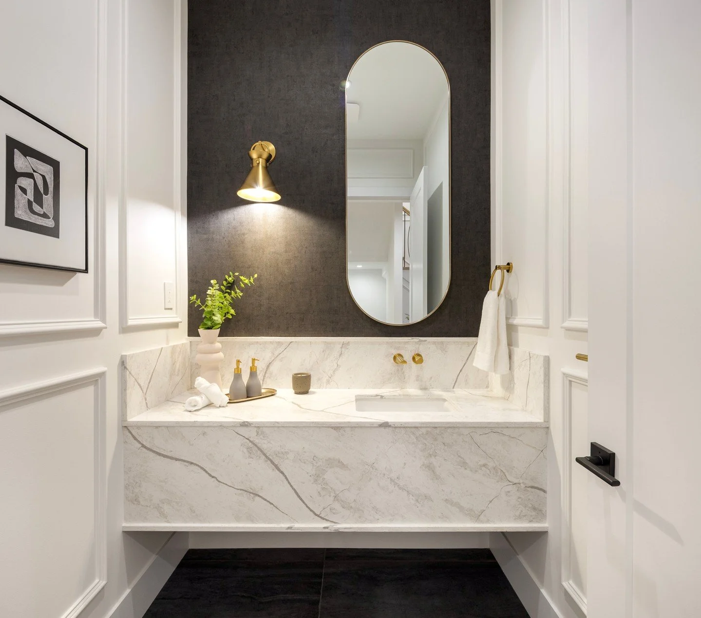 The Palliser Chateau / Elevating balance ✨
This powder room draws the eye upward with a capsule mirror, perfectly grounded by a sculptural marble vanity and accented with warm brass lighting.
Built by @quantus.homes
Architectural @homesby.sds