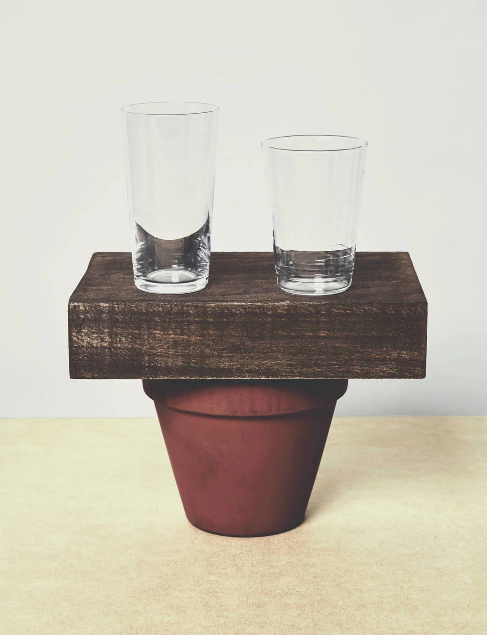 “There is an almost emphatic sense of reason and rationality to the object arrangement,” notes Koren of the meeting of two glasses, a wooden block, and a flower pot. The pictorial intensity is enough to sustain interest, he concludes, until “you run up against the conceptual dead-end” of the plain, non-descript nature of the objects themselves. Pictured: Serax Beaker Drinking Glass , Collected by The Line 5.3 oz Glass