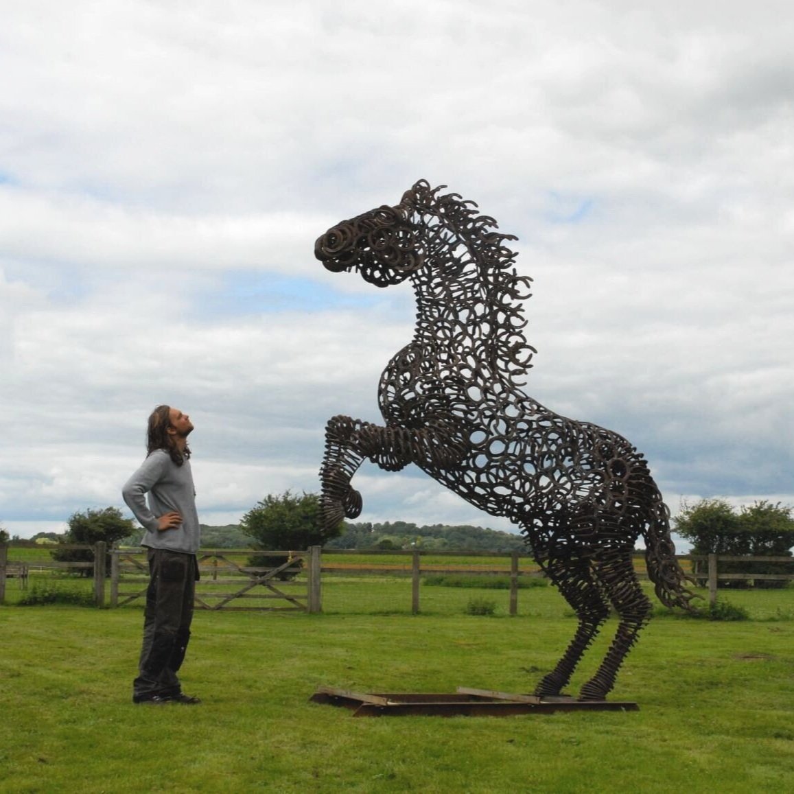 Man and rearing horse sculpture. 