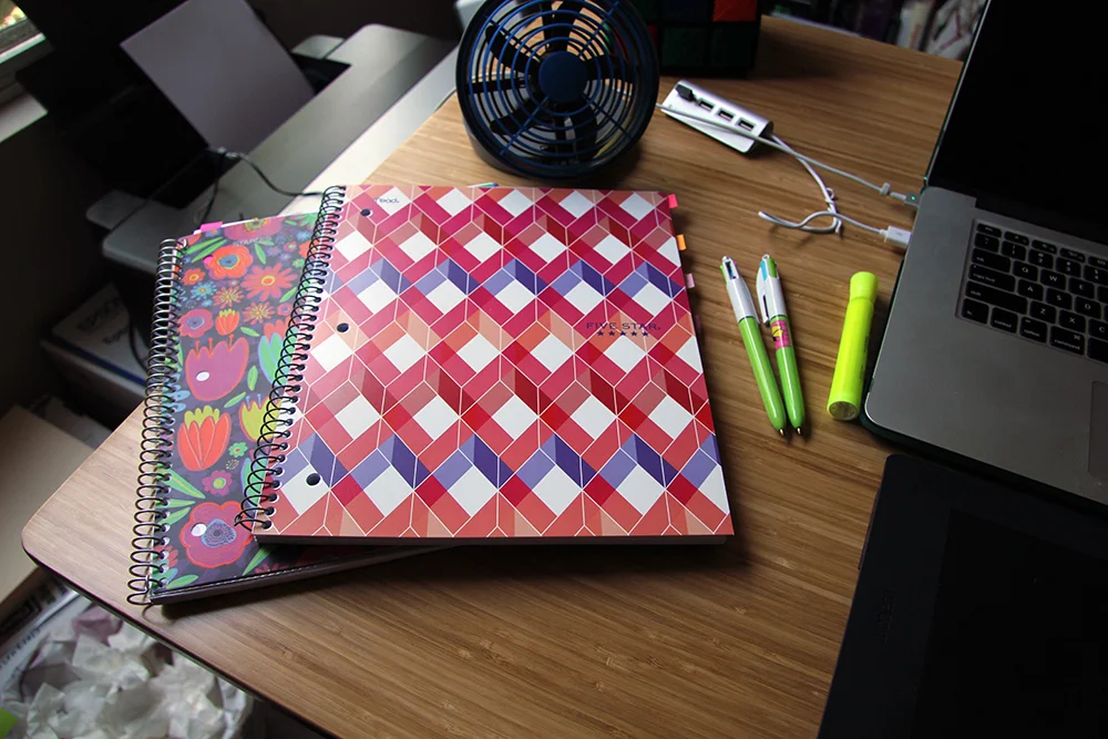 I’m such a notebook person. I have notebooks for everything! Different topics go in different ones. And yes, I am that person who coordinates tabs to the notebook colors. I find it very fun. I also have my special pens featured here with my highlighter. Those are essential for me. I have to have the right pens to write with while I work.
