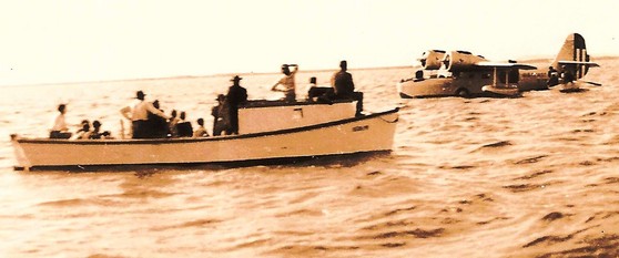 Josephus Daniels arrives by seaplane in Swan Quarter Bay.