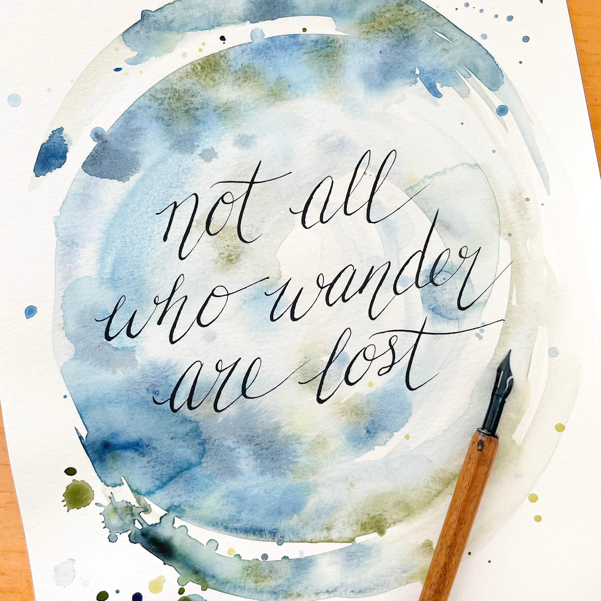 A custom calligraphy quote with painterly watercolor washes of indigo blue and evergreen shades melding together for the background 🖋️🎨