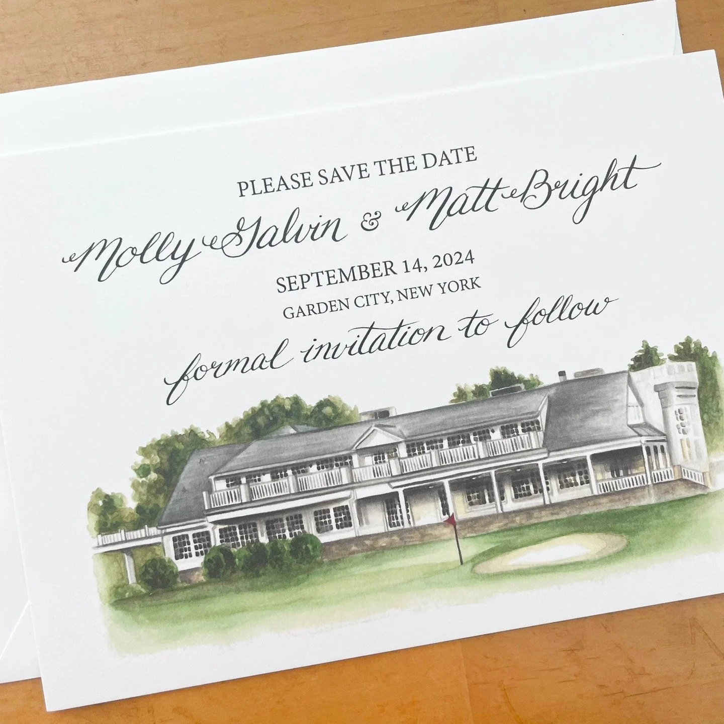This custom watercolor save the date card came together with classy yet windswept calligraphy, and a detailed architectural painting of a country club complete with a golfing green! Get in touch to get started on your own one-of-a-kind wedding statio