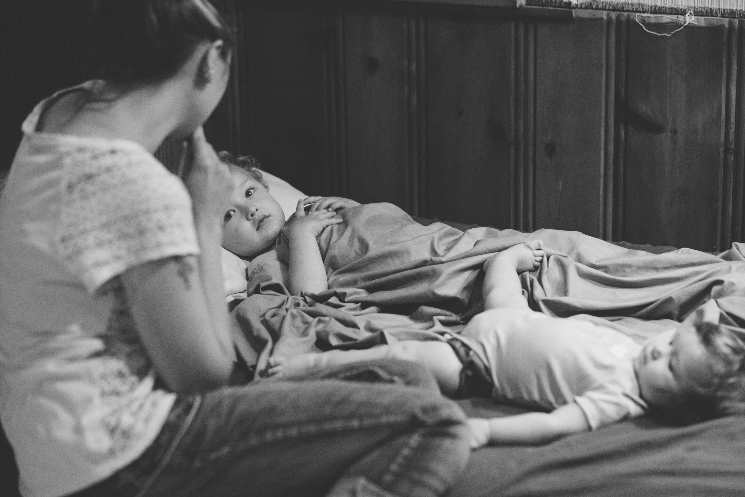 Son and daughter gazing at mom.