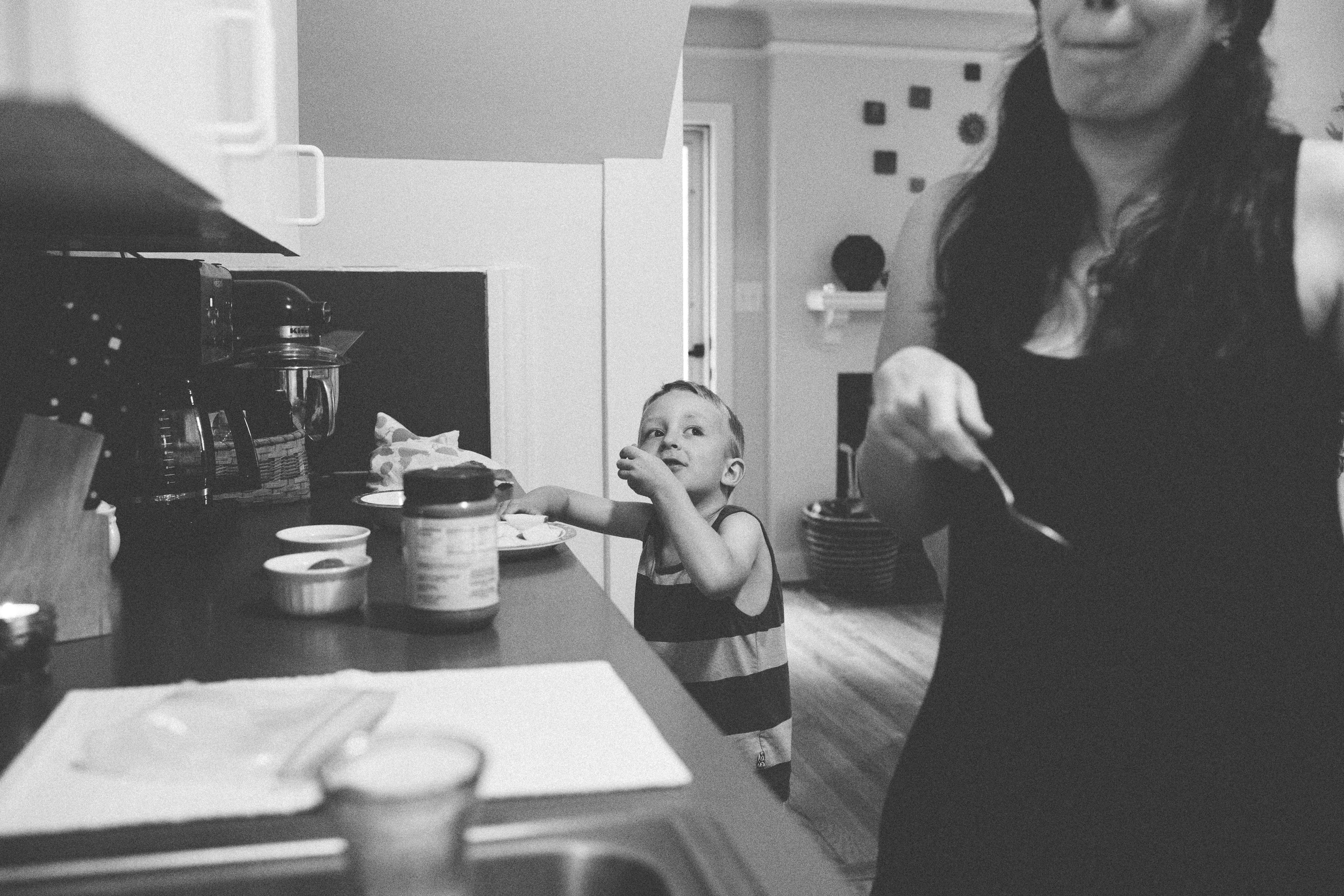 Mom and boy making lunch.