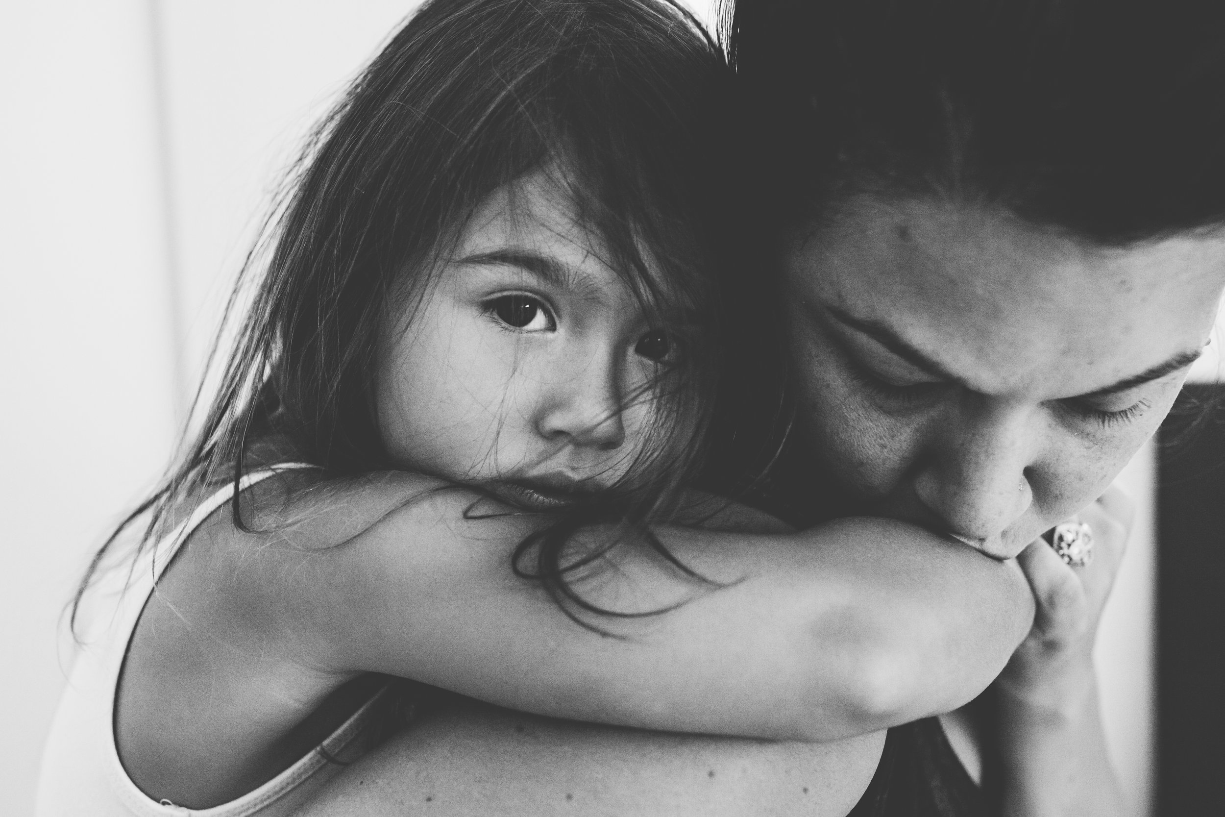 Mom and daughter hugging.