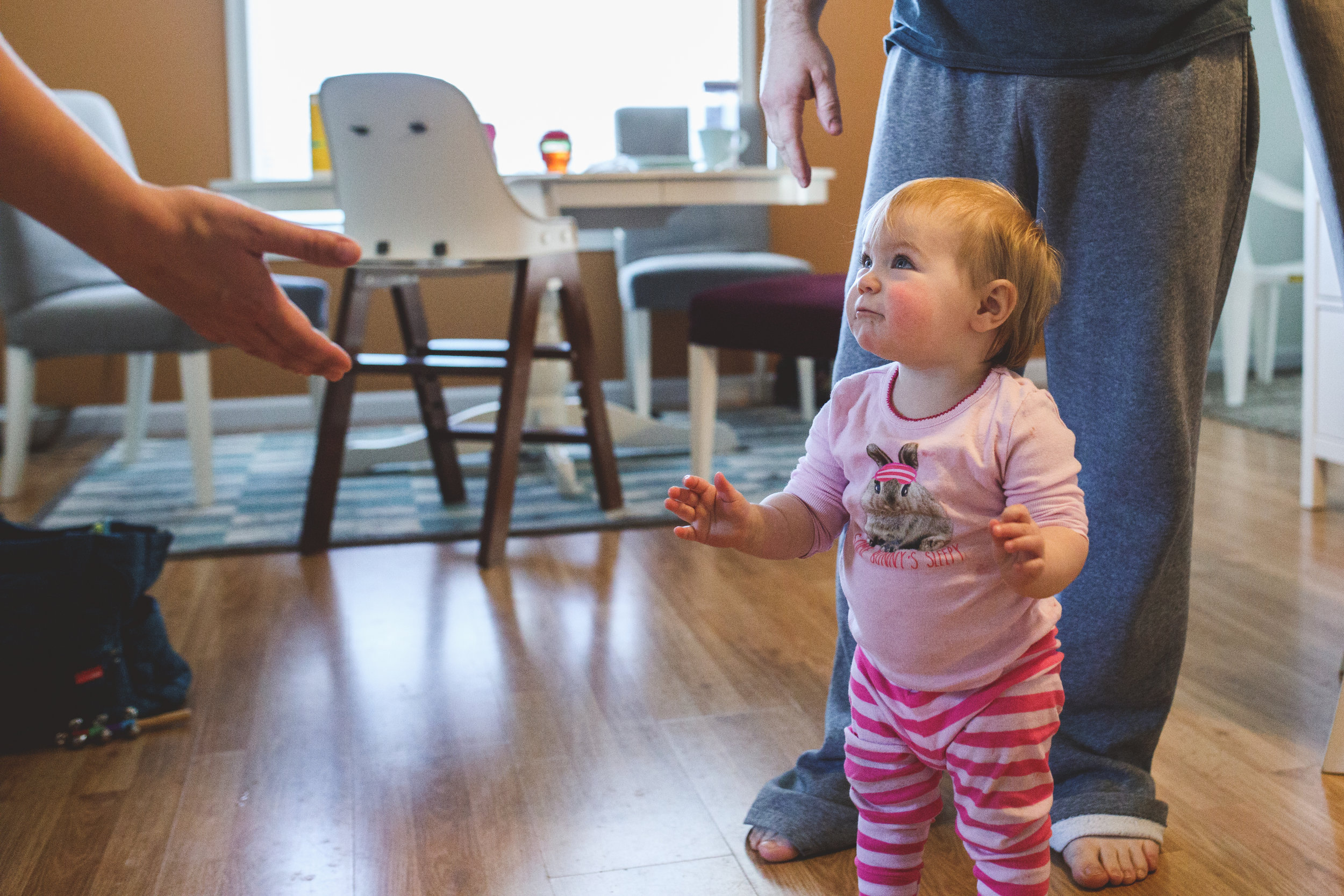 Mom reaching for walking toddler. Ferndale Family Photographer. Metro Detroit Family Photographer.