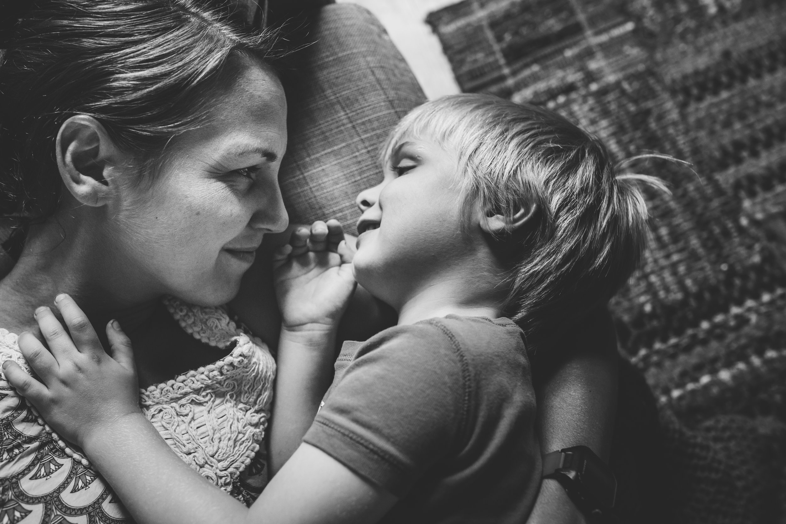 Mom gazing at little boy.