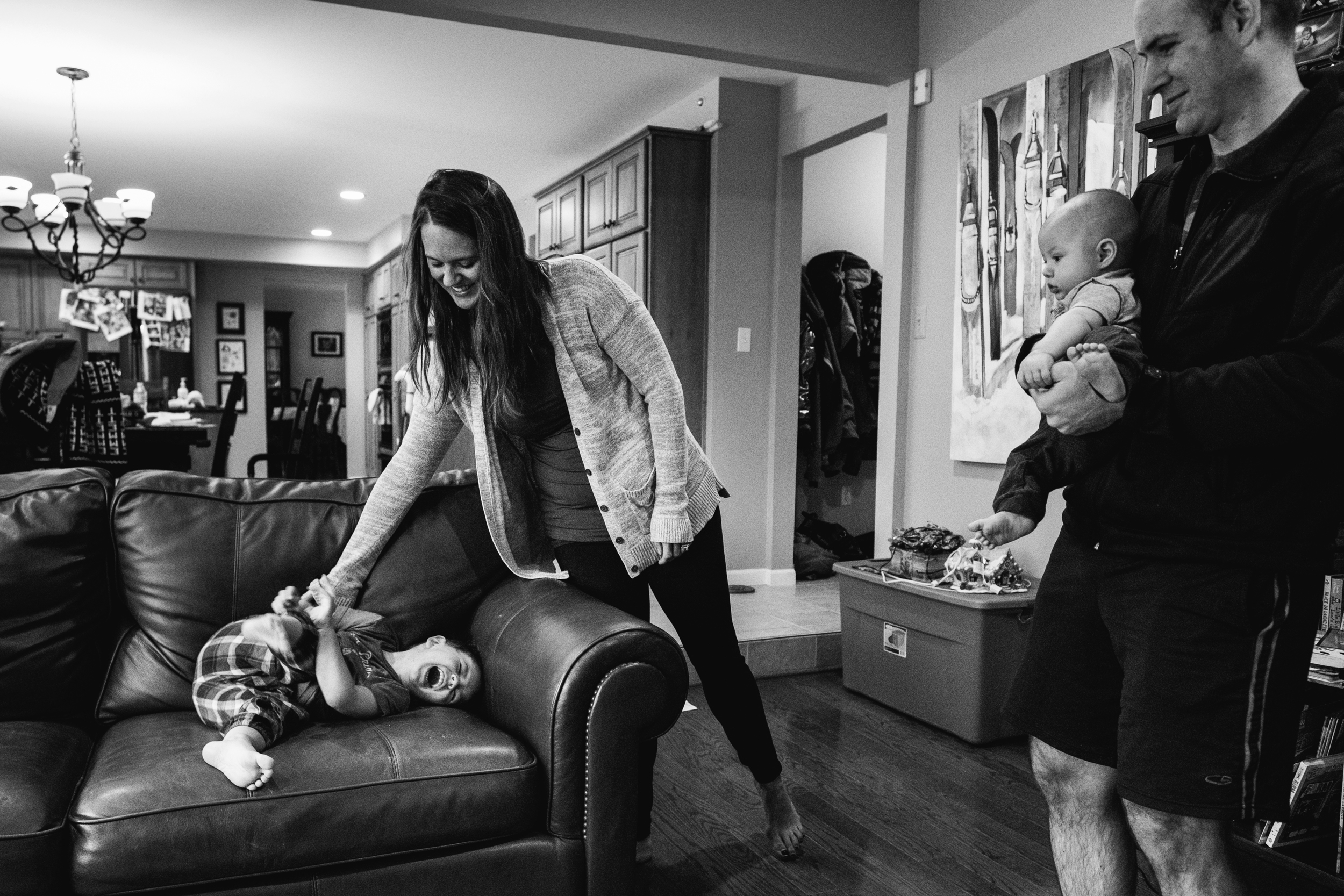 Mom tickling son. Metro Detroit Ferndale Family Photographer
