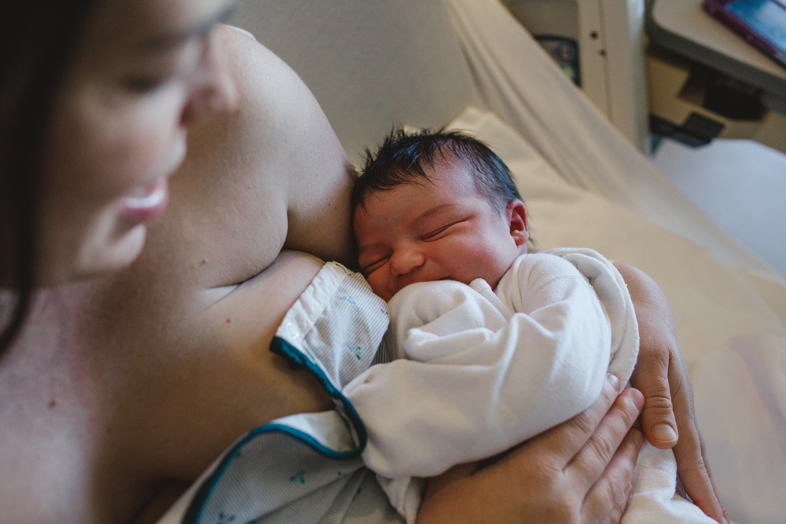 Mama holding new baby.