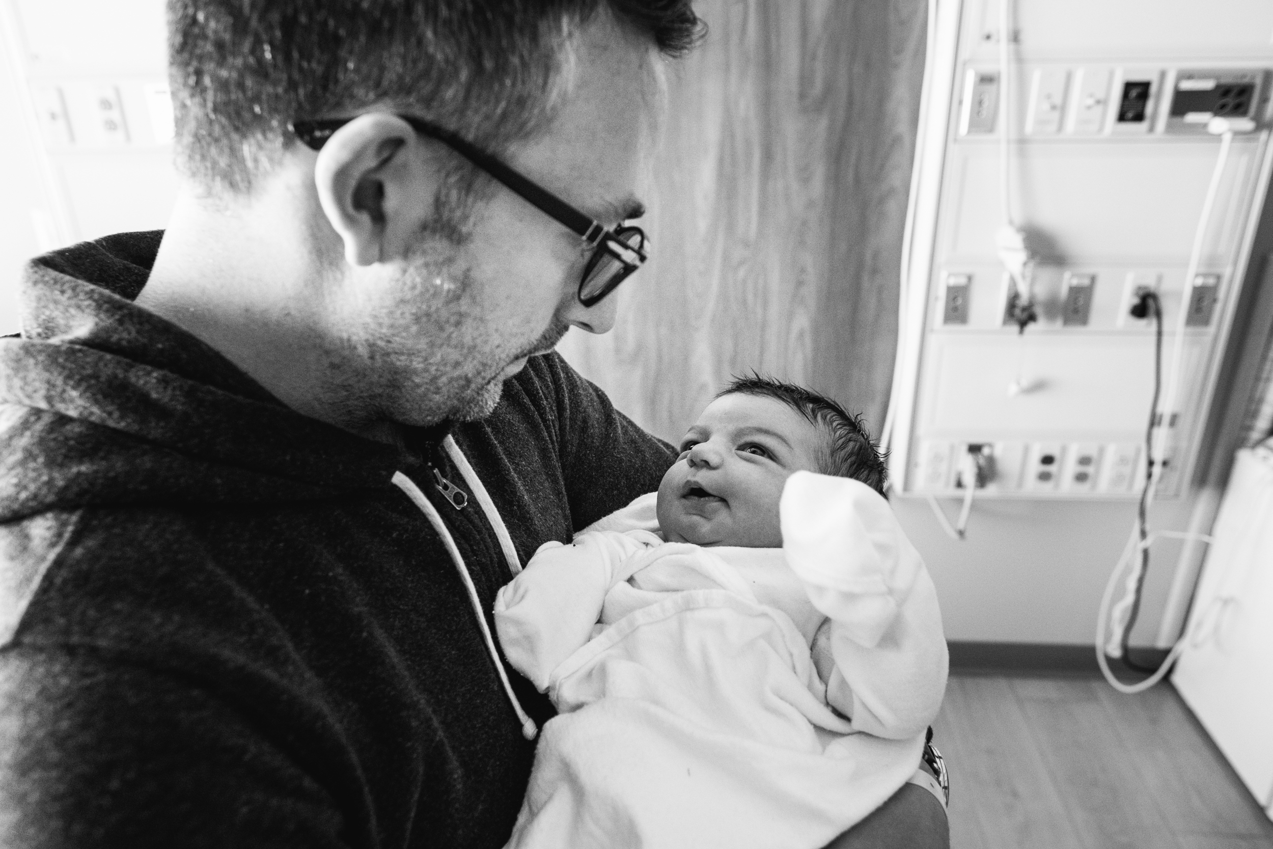 Baby gazing lovingly at dad