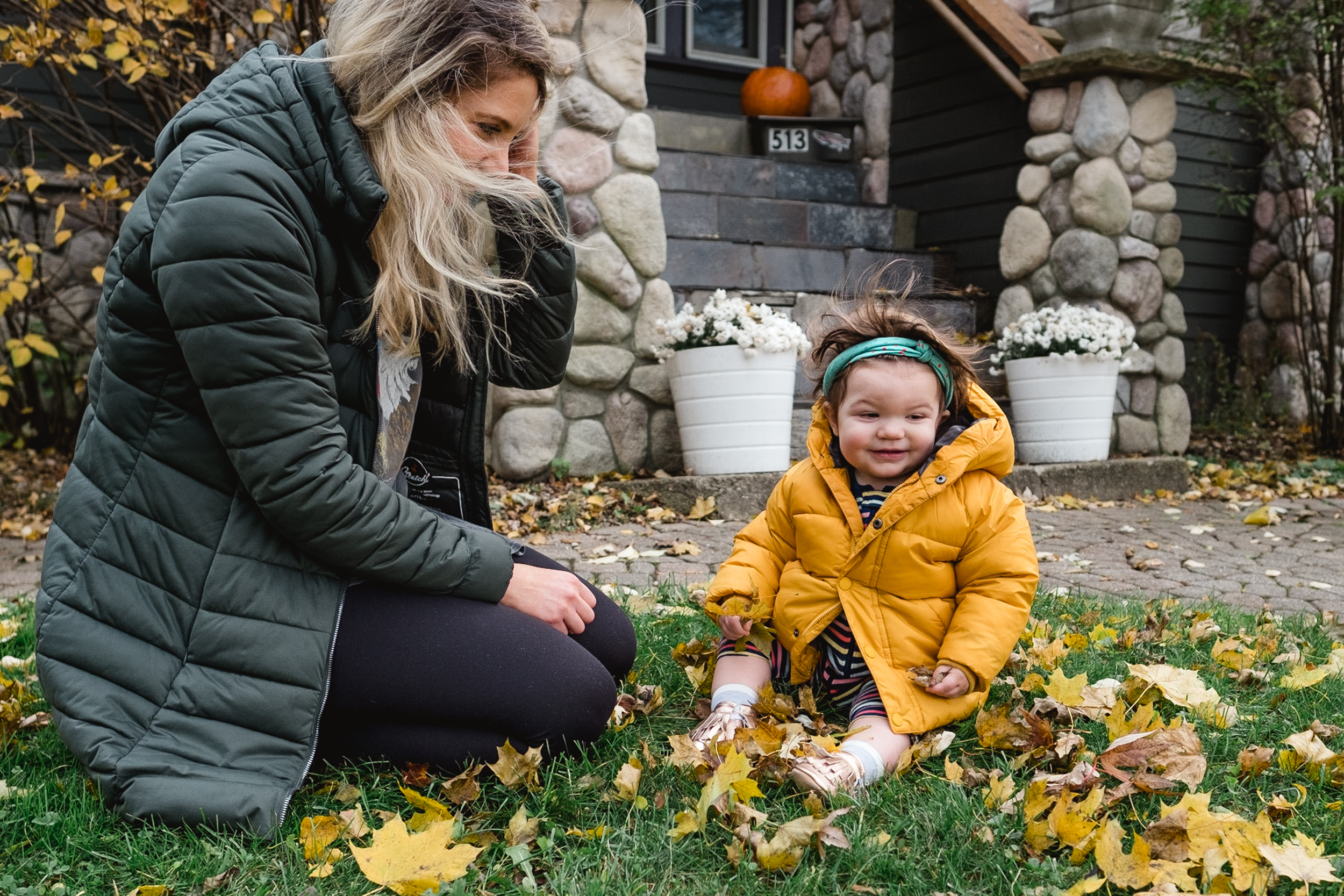 Playing in the leaves with the wind blowing. Royal Oak Family Photographer. Detroit.