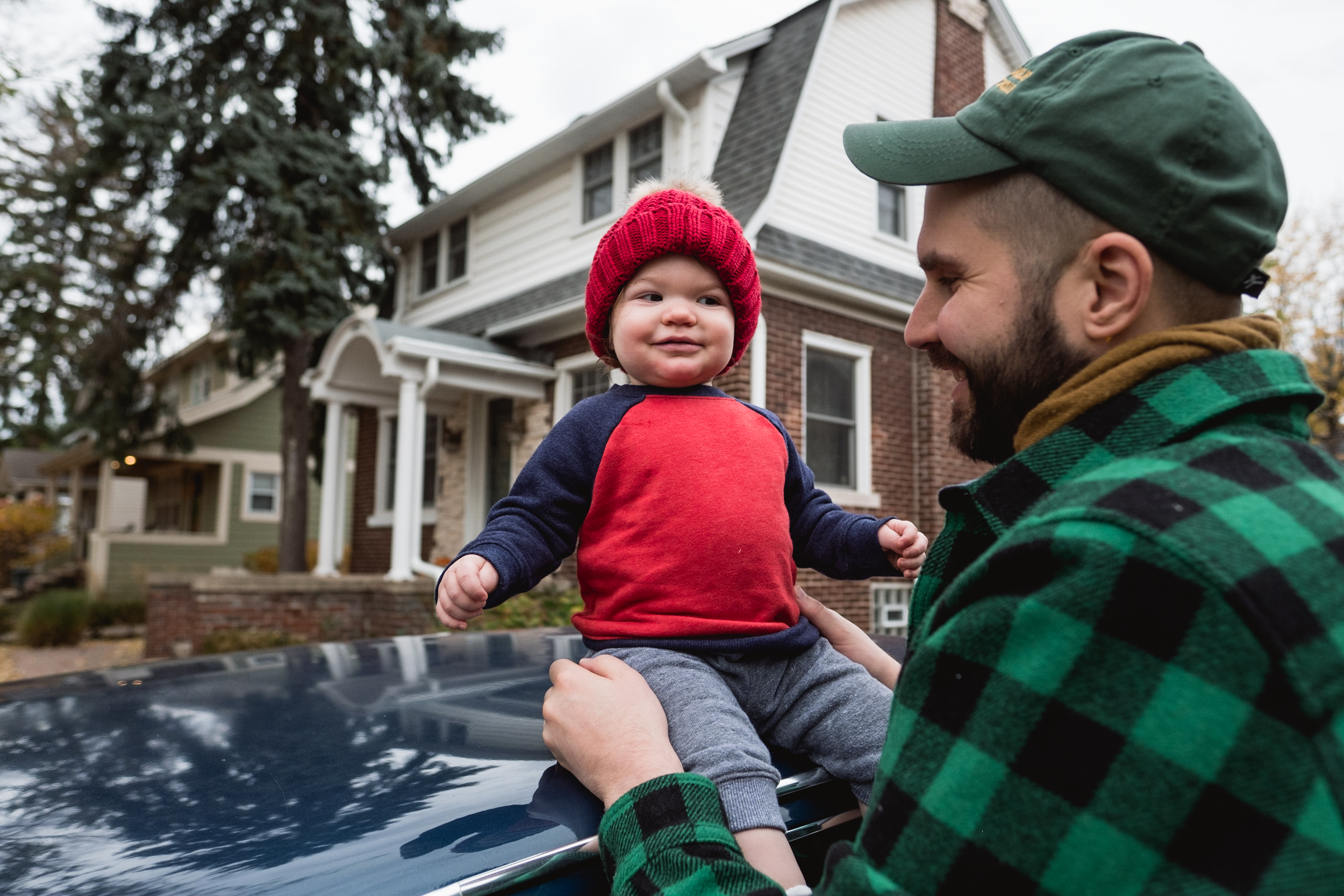 Sitting on daddy's car. Royal Oak Family Photographer. Detroit Family Photographer.