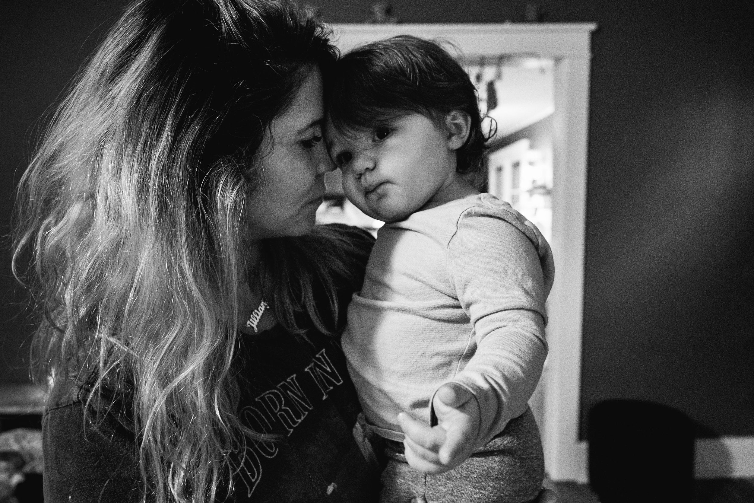 Baby and mama pushing heads together in love. Royal Oak Family Photographer. Detroit Family Photographer.