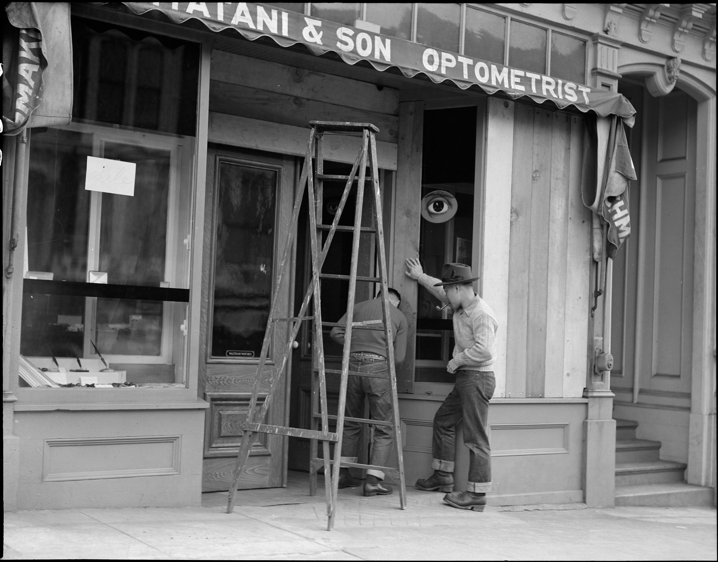  San Francisco, California. Owners of Japanese ancestry board up windows of their stores prior to evacuation. Evacuees will be housed in War Relocation Authority centers for the duration. 