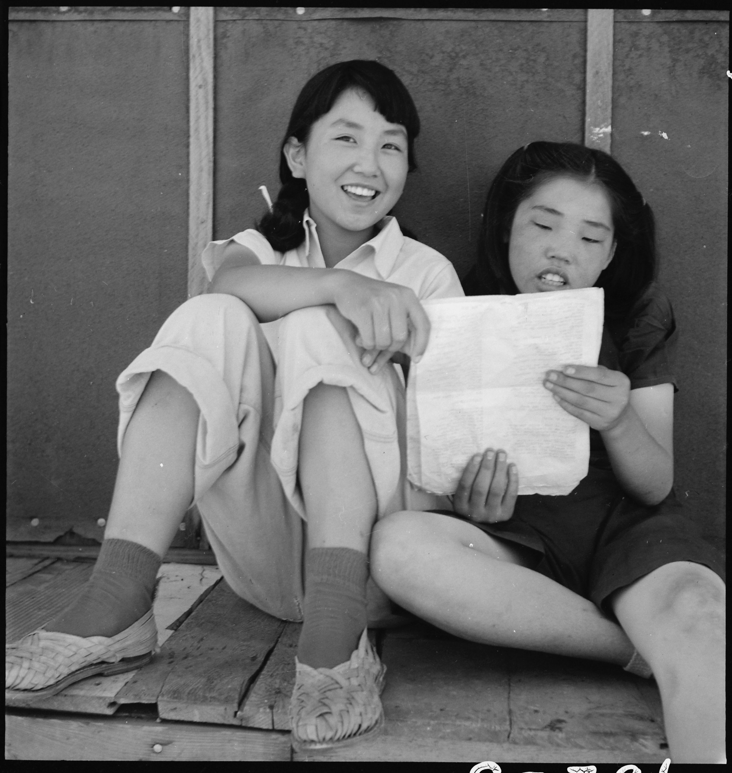  Manzanar Relocation Center, Manzanar, California. Evacuee girls practicing the songs they learned in school prior to evacuation to this War Relocaction Authority center for evacuees of Japanese ancestry. 