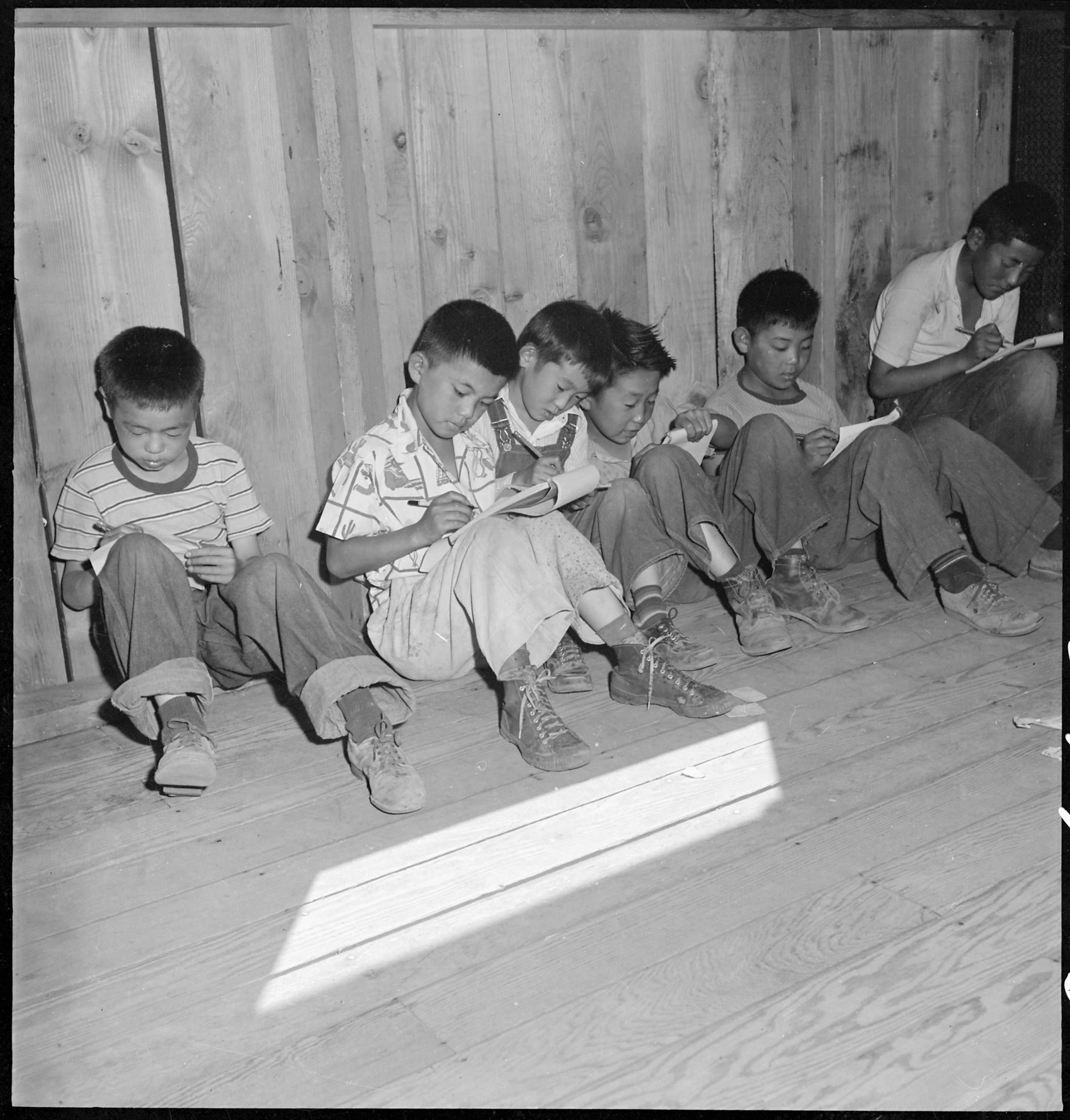  Manzanar Relocation Center, Manzanar, California. An elementary school with voluntary attendance has been established with volunteer teachers, most of whom are college graduates. These young evacuees are eager to learn and do not mind the lack of eq