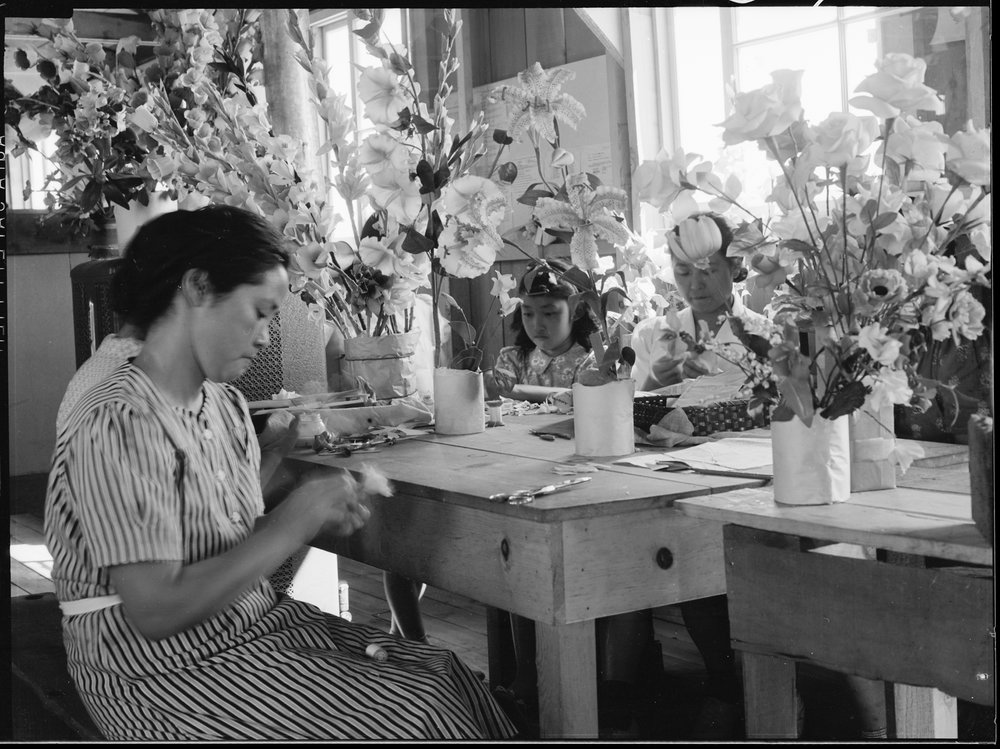   PRINT AVAILABLE   Manzanar Relocation Center, Manzanar, California. Making artificial flowers in the Art School at this War Relocation Authority center for evacuees of Japanese ancestry. 