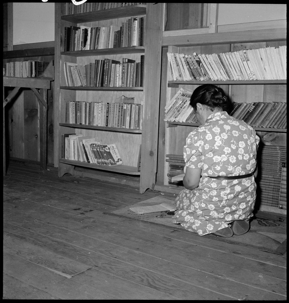  Manzanar Relocation Center, Manzanar, California. A corner in the library at this War Relocation Authority center for evacuees of Japanese ancestry. This section contains books in the Japanese lanuage, most of which are translations of English class