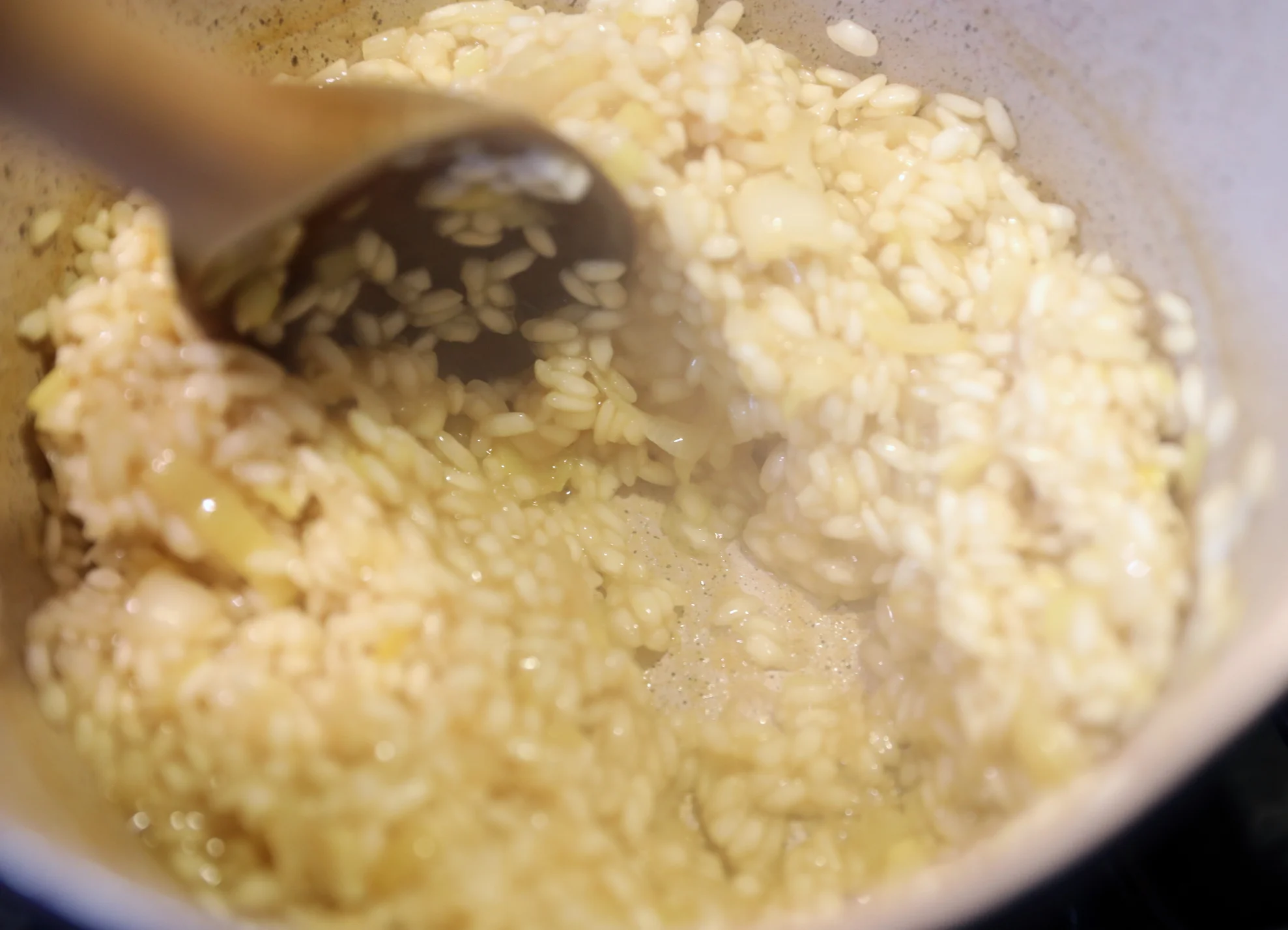 The rice has absorbed our first cup of broth so now we can add the second cup. 