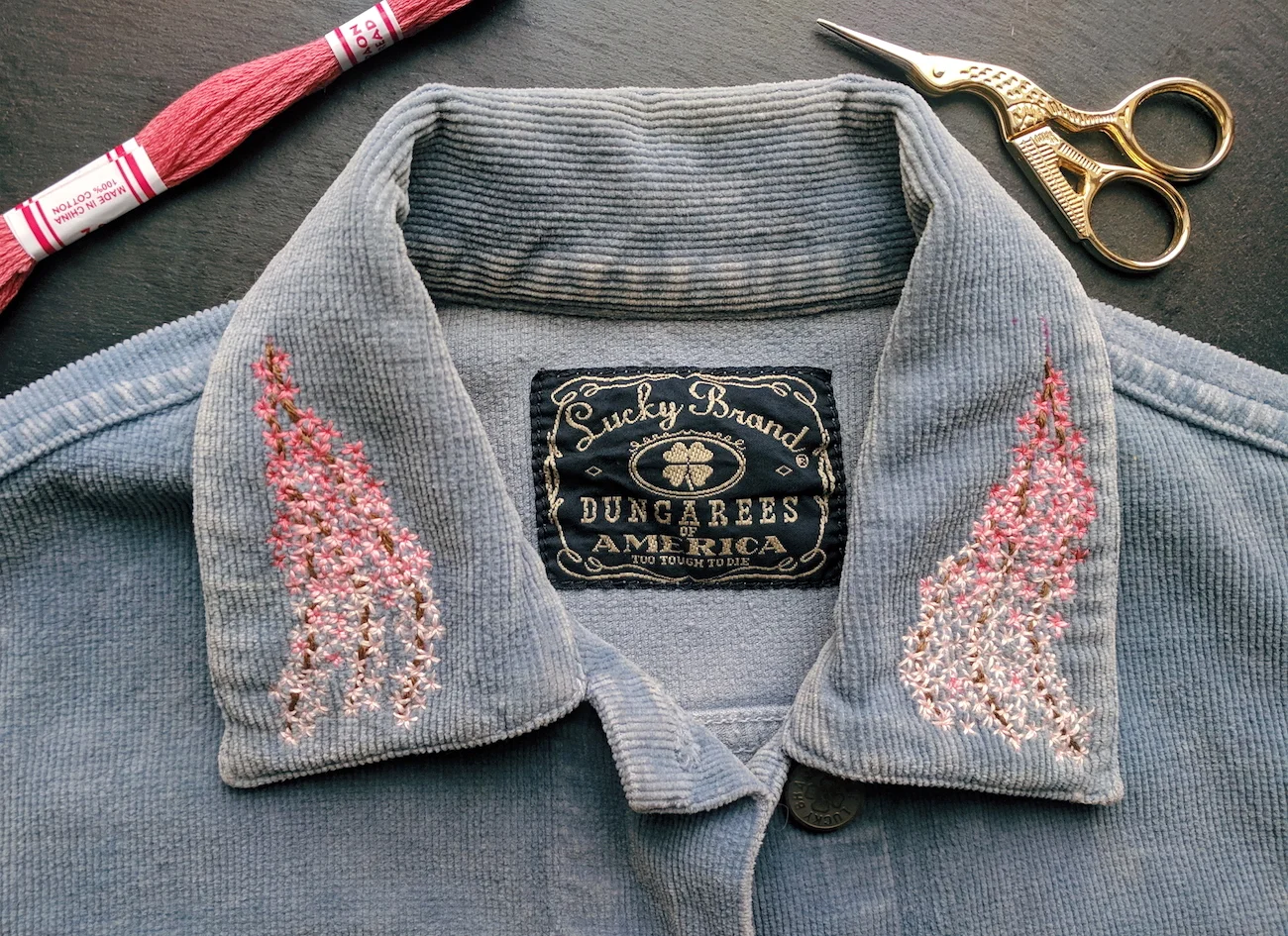 Cherry blossoms on the collar of a vintage corduroy jacket