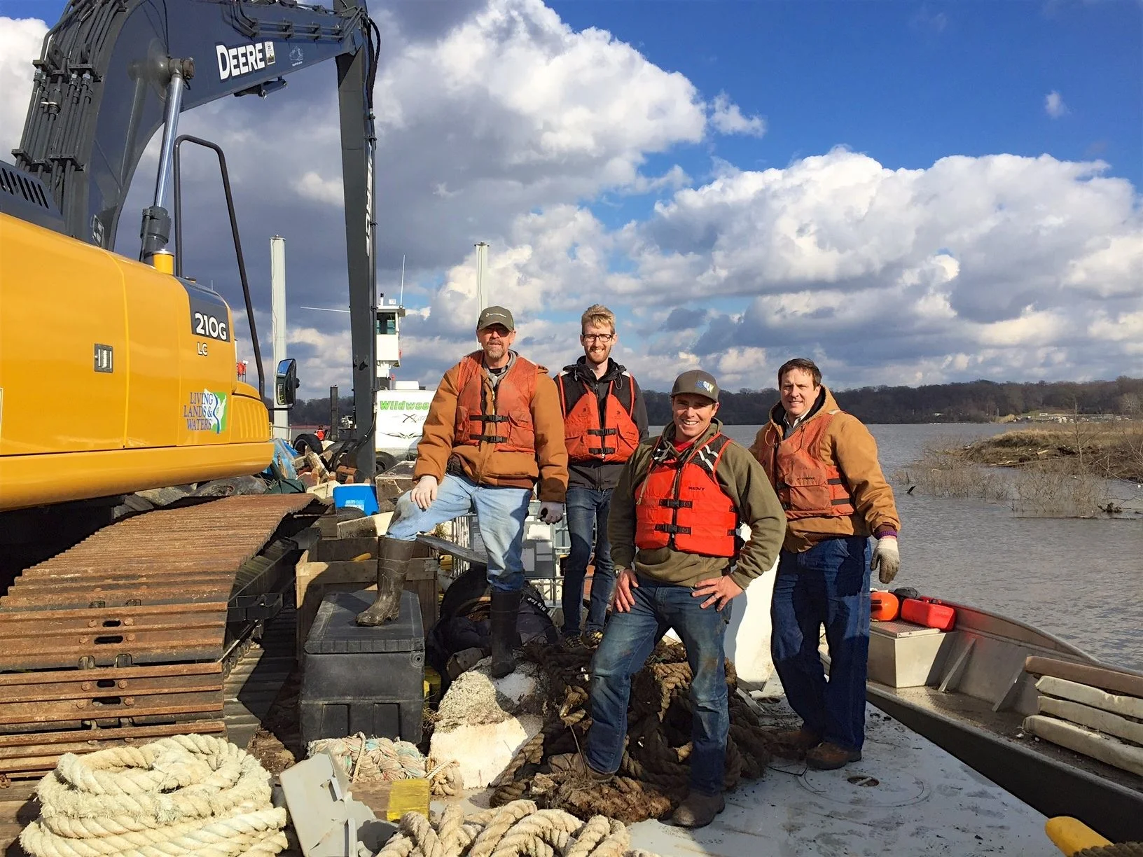 Pictured left to right: John Bradburn, GM; Daniel Kietzer, US BCSD; Chad Pregracke, Living Lands and Waters; and Steve Tullos, Entergy on the Living Lands and Waters barge outside of Memphis, TN.
