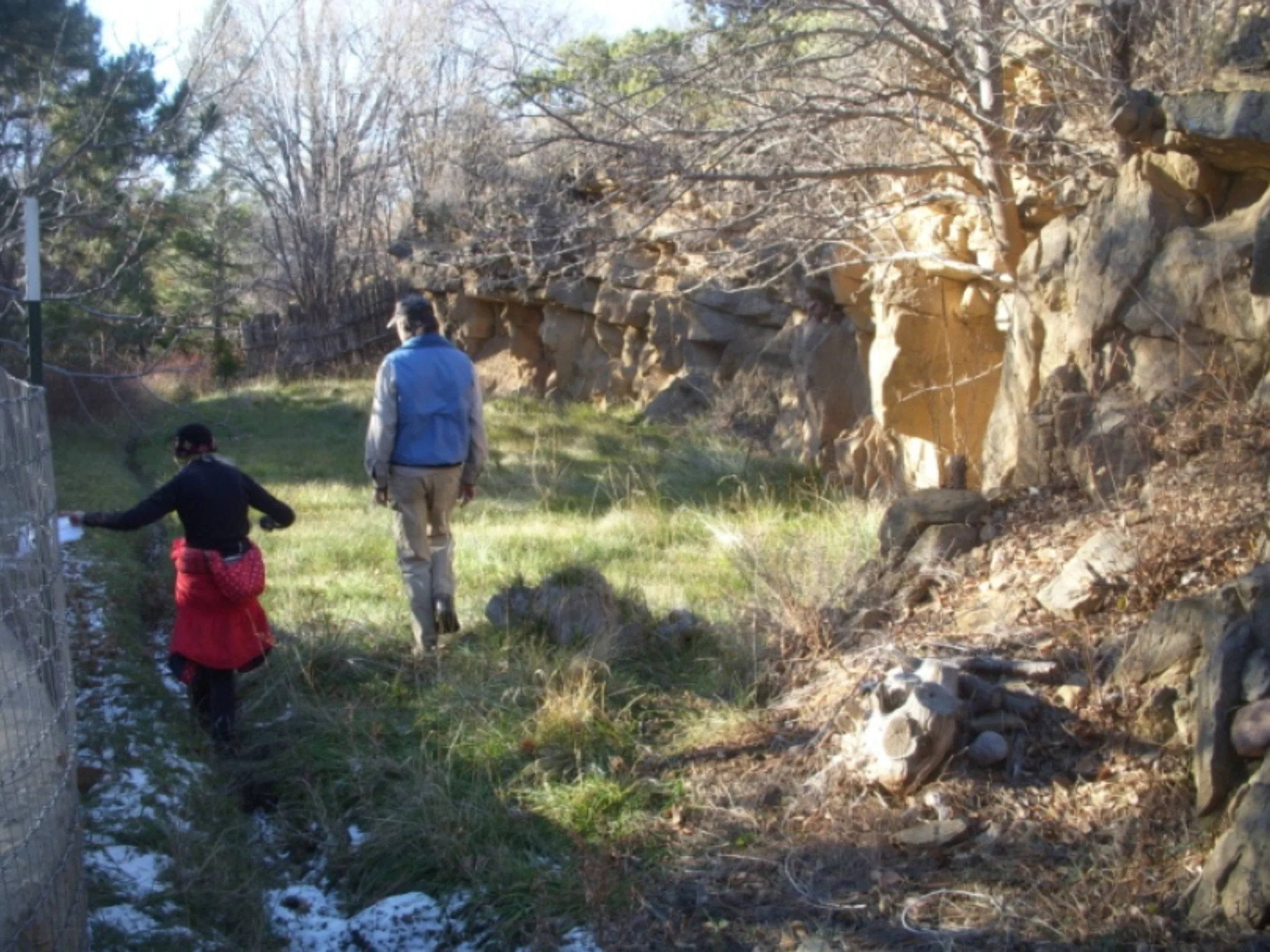 Deborah Lawrence and B.C. Rimbeaux where the acequia traverses the grassy section below the embankment behind the Krause house. photo by the Deborah and Jon Lawrence