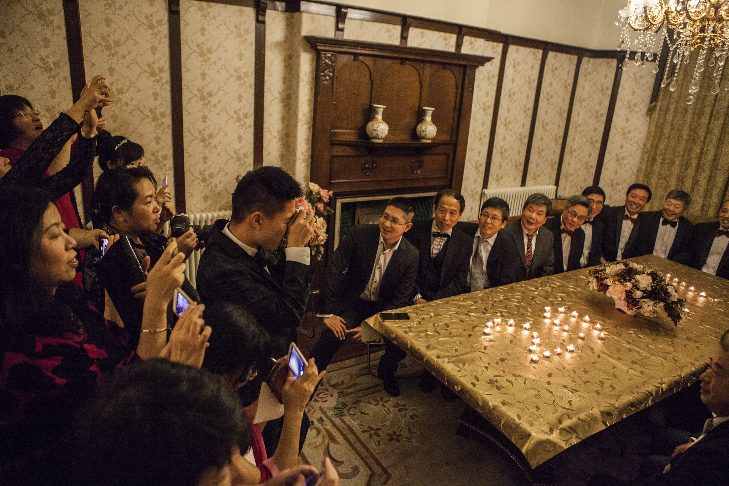  Gentlemen’s photo at the Zhangs’ house - an annual tradition of photo-taking to document those present at a table lit with candles spelling the new year. 