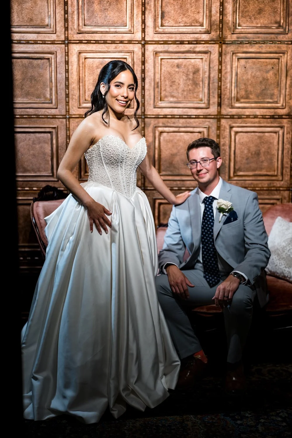 The Society Room of Hartford wedding photographer, Hartford, CT â€” couple portrait against the carved bronze-toned paneling inside the historic bank building