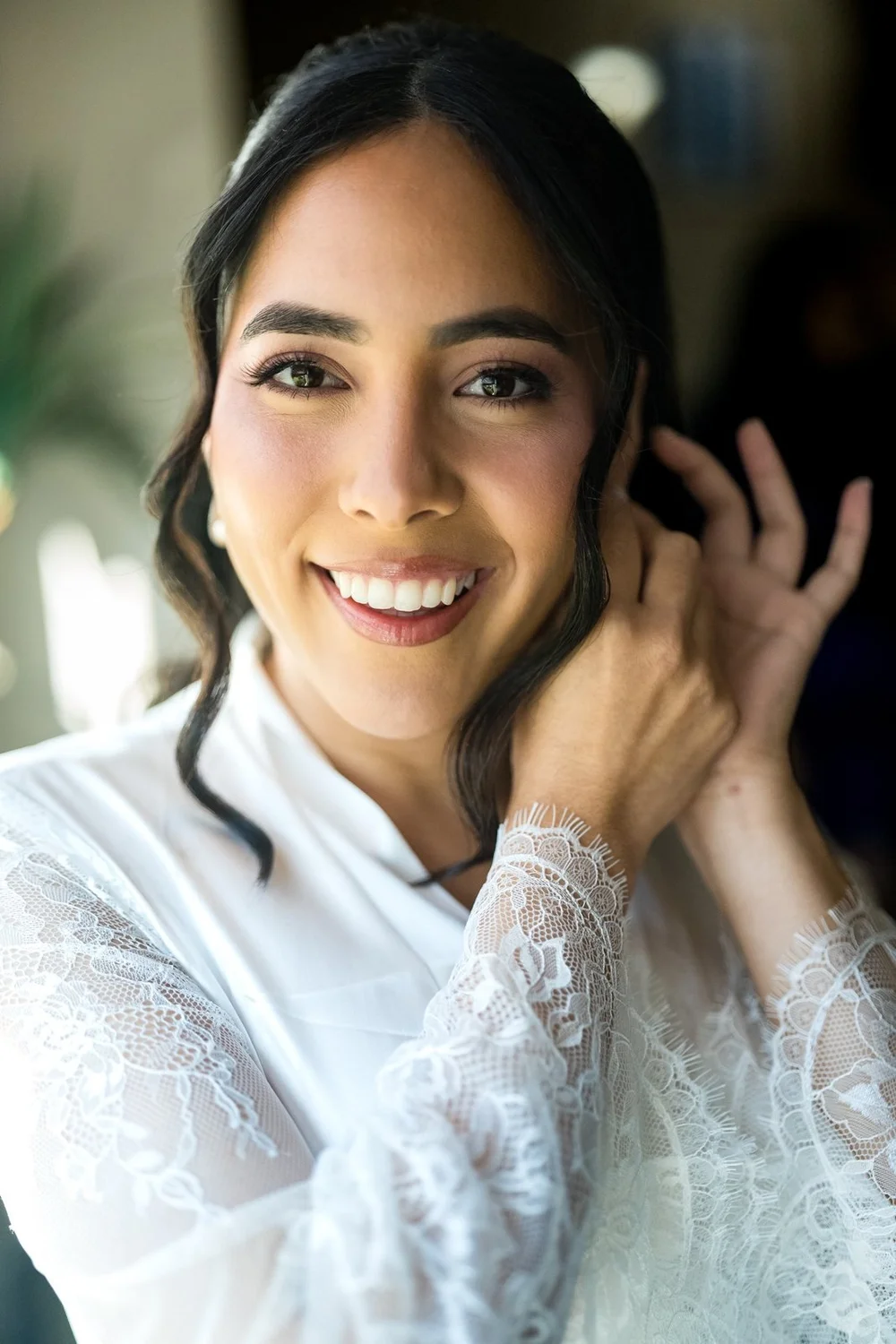 The Society Room of Hartford wedding photographer, Hartford, CT â€” bride smiling during final touches on the wedding morning