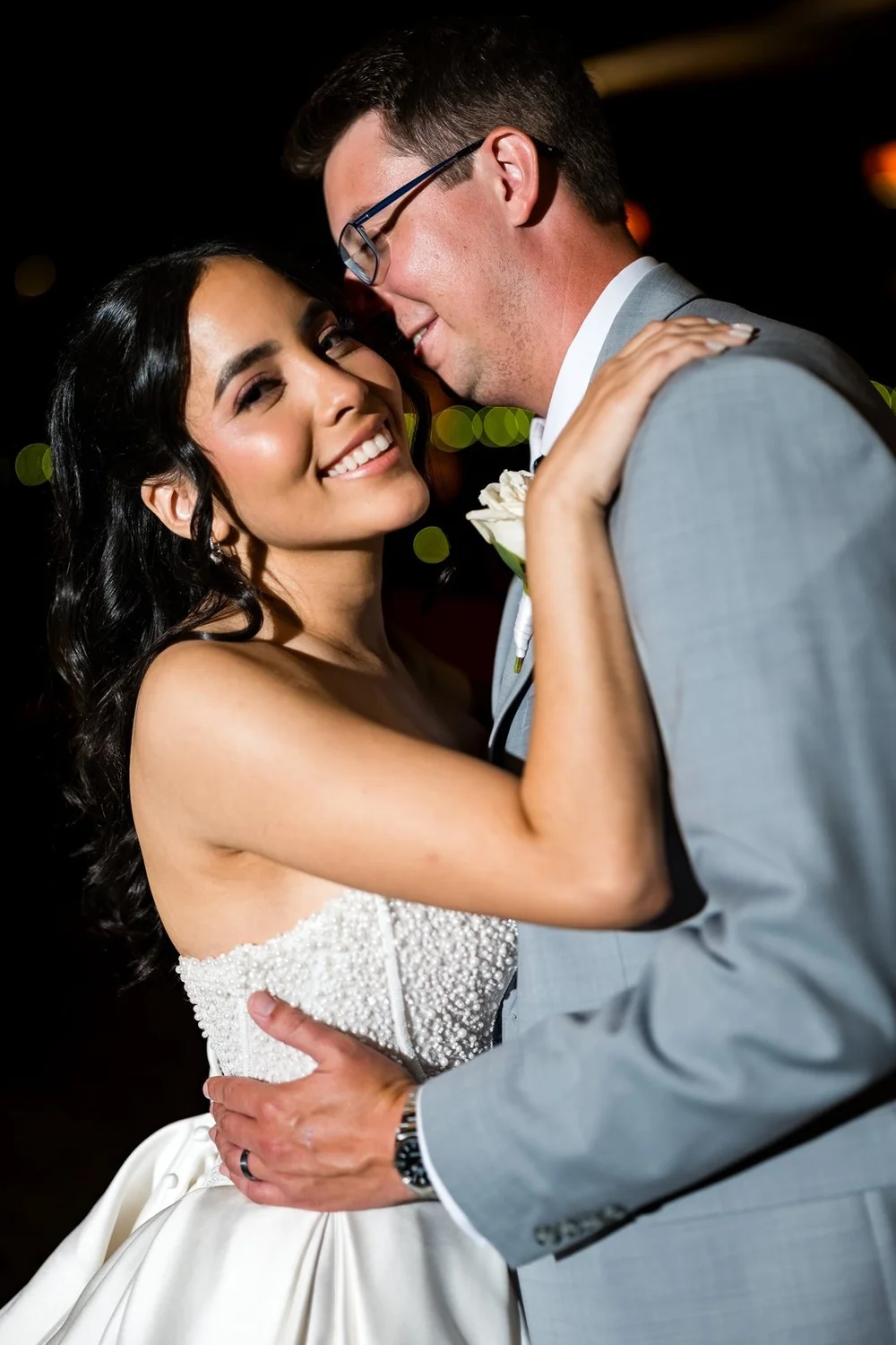 The Society Room of Hartford wedding photographer, Hartford, CT â€” bride laughing as the groom pulls her close during evening portraits