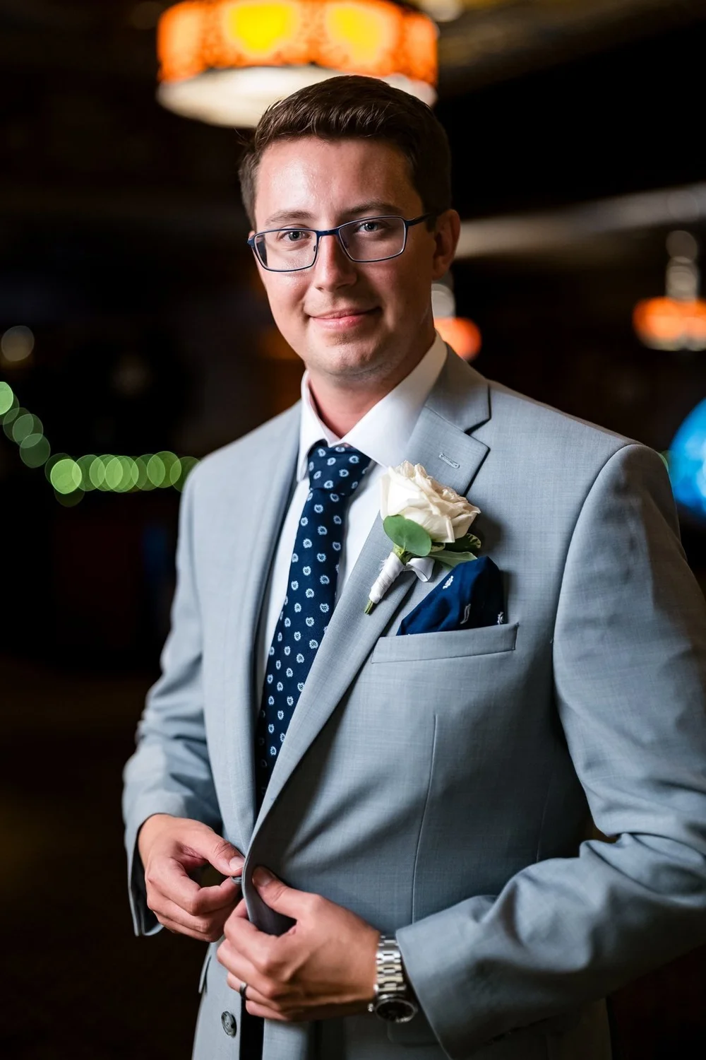 The Society Room of Hartford wedding photographer, Hartford, CT â€” groom portrait in a light gray suit and navy tie