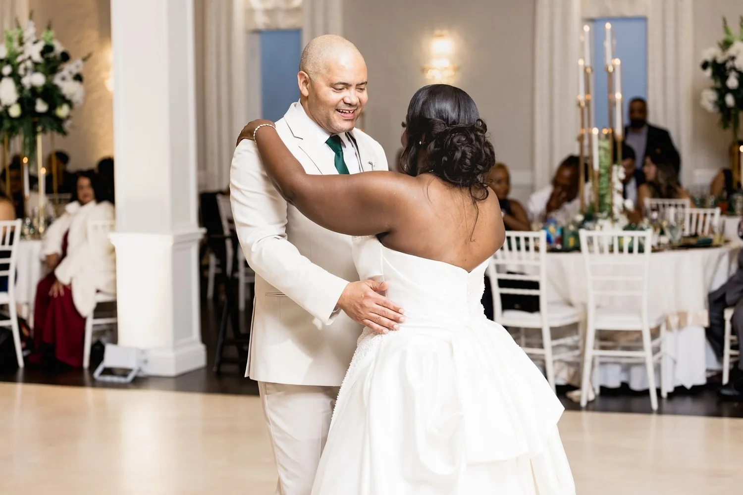 Avenir wedding videographer, Walpole, MA — first dance on the reception floor beside white columns and round tables