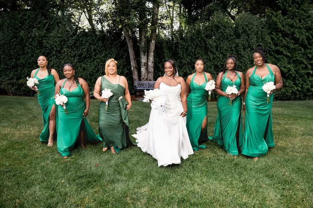 Avenir wedding photographer, Walpole, MA — bridesmaids in emerald satin celebrating with the bride on the lawn