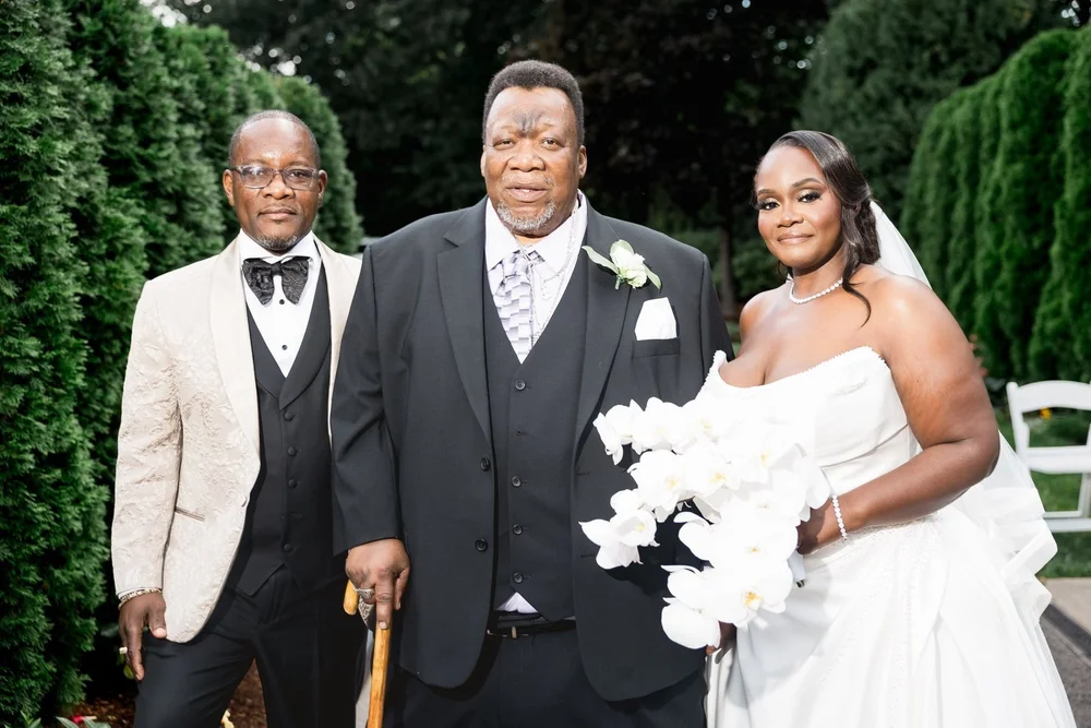 Avenir wedding videographer, Walpole, MA — bride and groom with family on the garden lawn