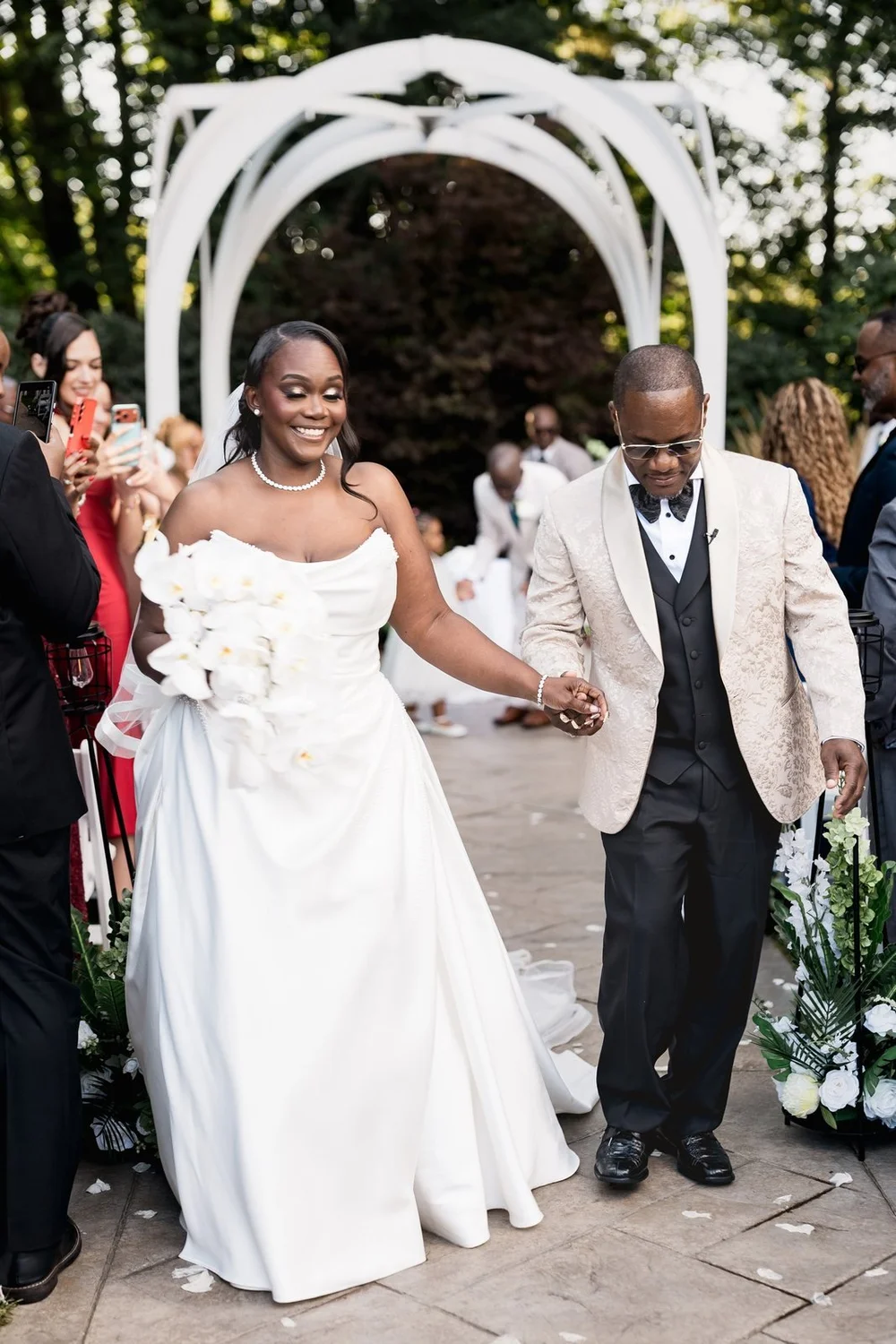 Avenir wedding photographer, Walpole, MA — bride celebrating with the groom on the garden aisle