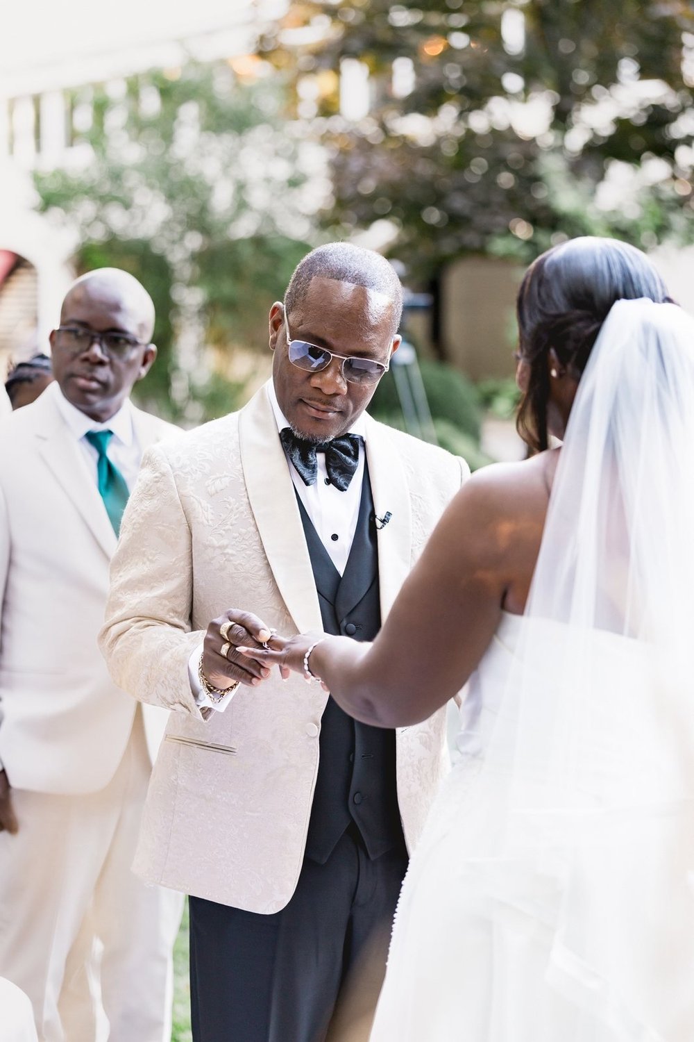 Avenir wedding photographer, Walpole, MA — father placing the bride's hand into the groom's at the arbor