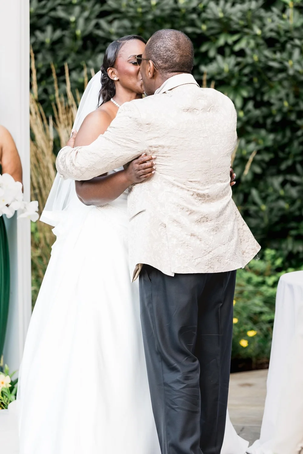 Avenir wedding videographer, Walpole, MA — bride and groom kissing at the end of the garden ceremony