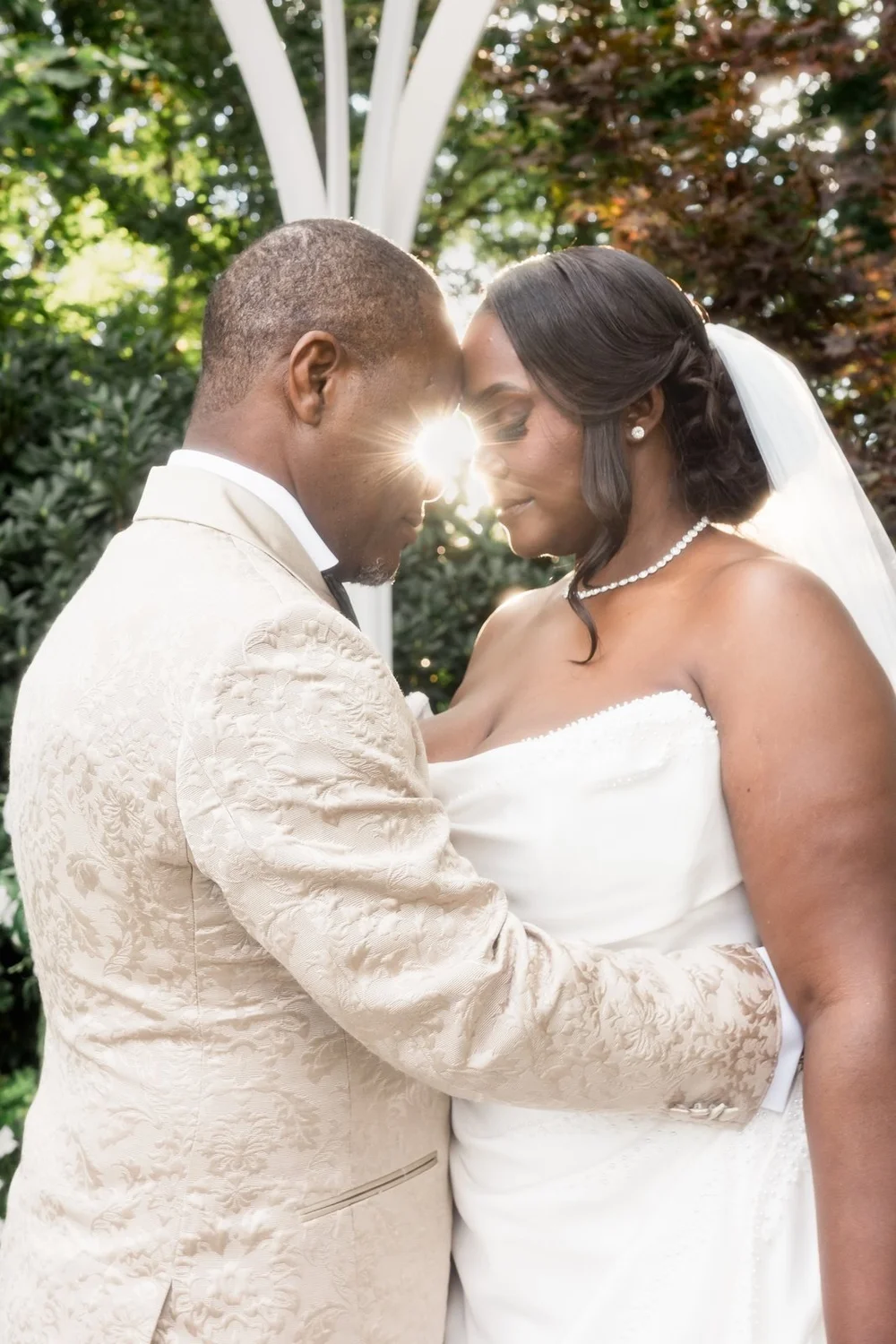 Avenir wedding videographer, Walpole, MA — backlit portrait of the couple in the evening garden light