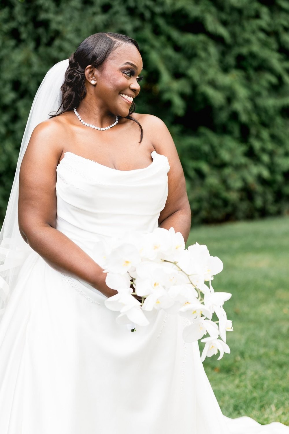 Avenir wedding photographer, Walpole, MA — bride laughing with her white bouquet on the garden lawn