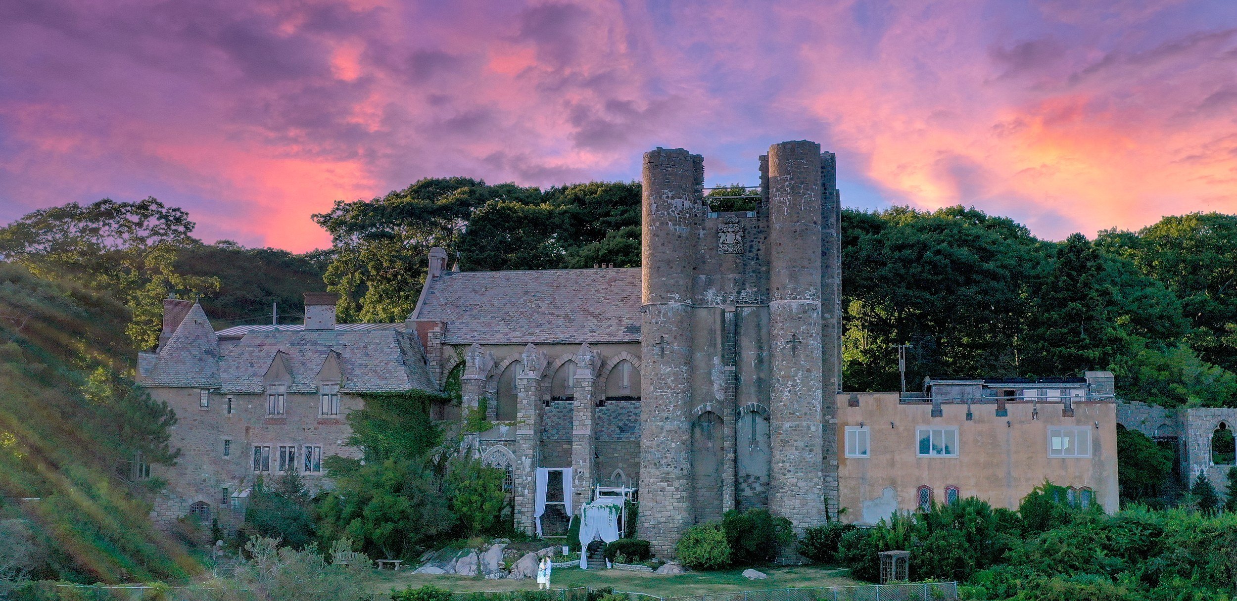 Hammond Castle above the Atlantic at dusk, its towers and stone roofline against a violet sky, Gloucester, Massachusetts