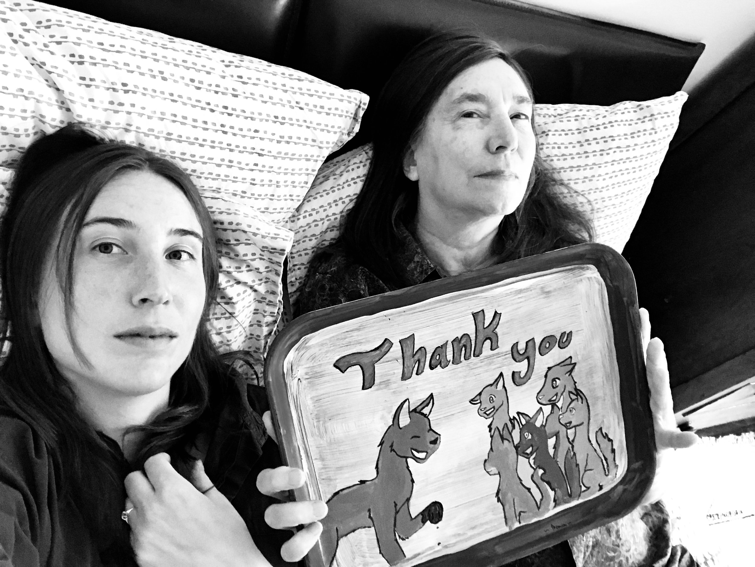 Lili Holzer-Glier and Jenny Holzer, who is holding one of her favorite items, a tray gifted to her by school children as a thank you for visiting their class.
