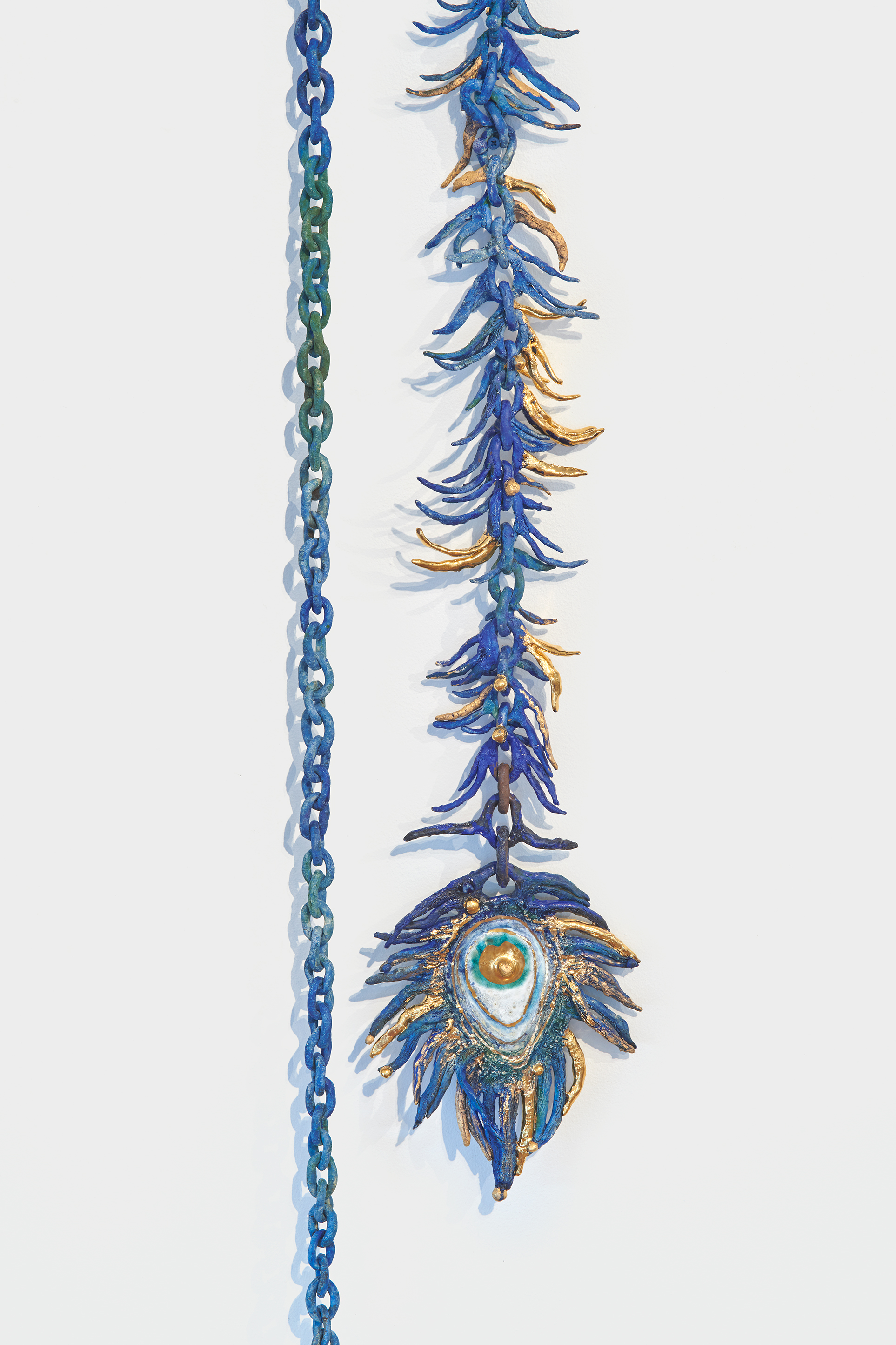 Heidi Lau, The Blue Peacock, 2018. Ceramics and gold luster, 102 x 8 x 3 cm. Courtesy of Geary. 
