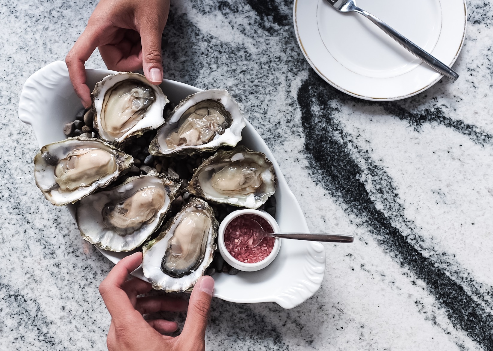 The deliciously meaty oysters paired with a house made mignonette.