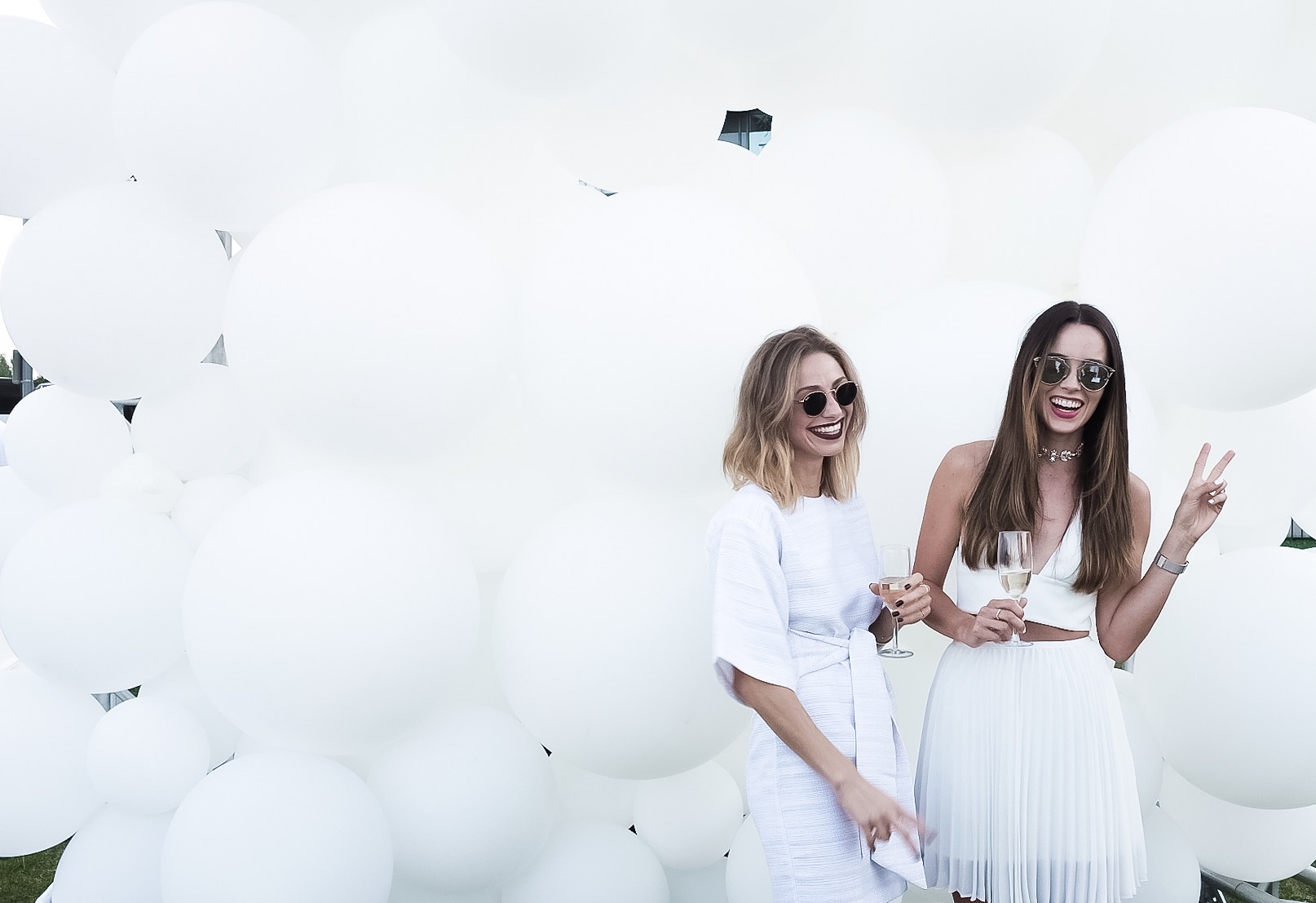 The beautiful Jill and Jodi in front of the balloon wall.