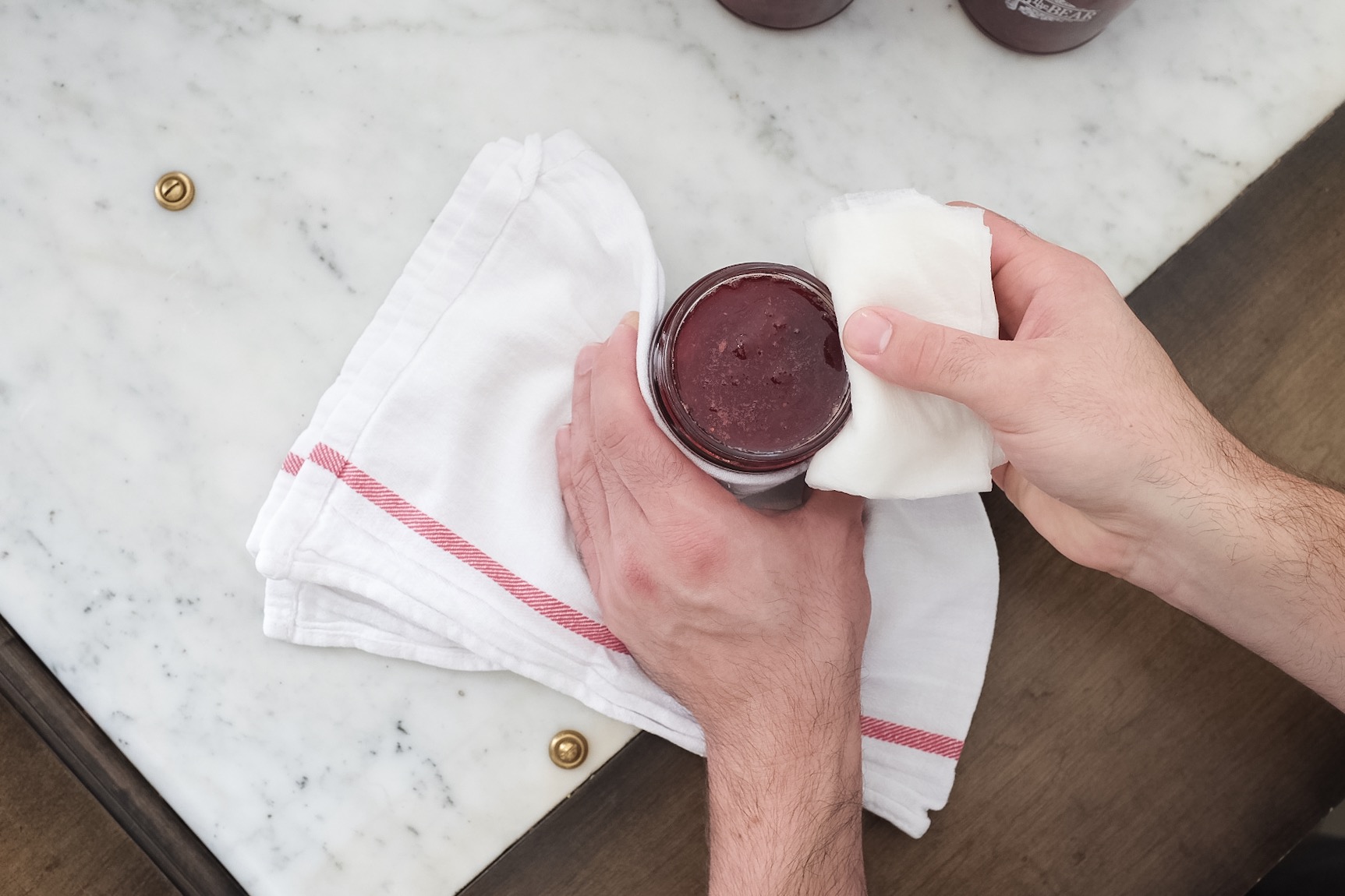 Bobby makes sure that each jar is carefully cleaned and lidded to ensure the longevity of the product.