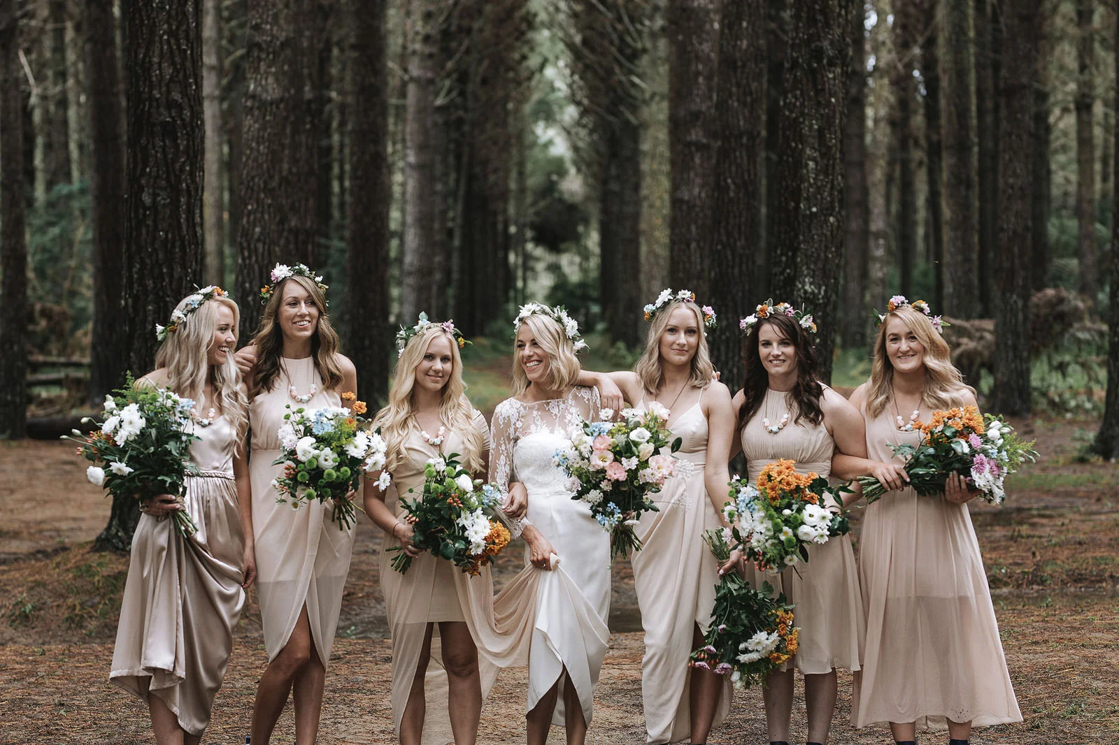 Beautiful nude tones on the eyes, soft coral lips and glowing natural skin was the look chosen for the bridesmaids and a slightly brighter coral lip for the bride. It worked so well on each one and went with the organic look that was created with the flowers and hair.